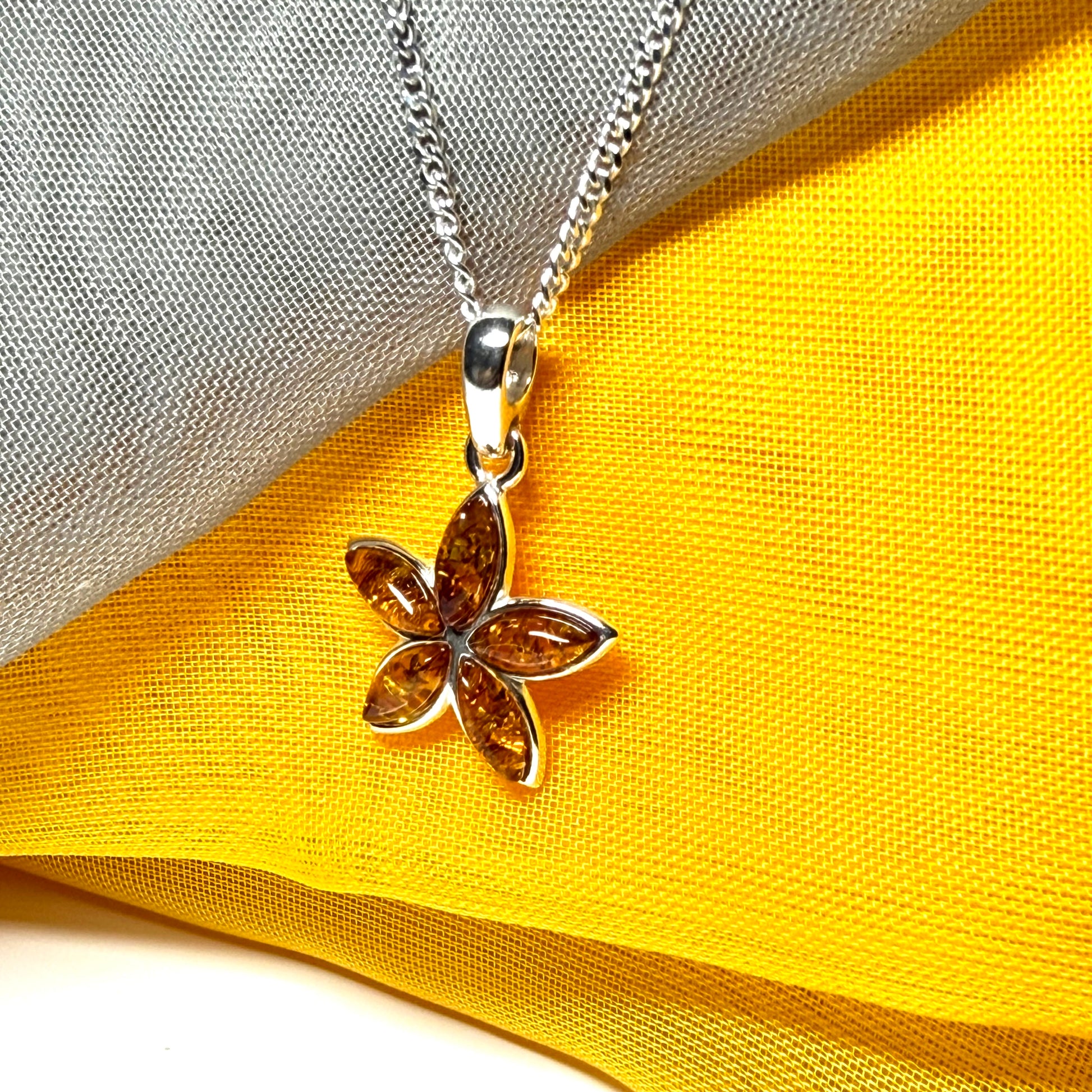 Real amber star shaped necklace sterling silver pendant