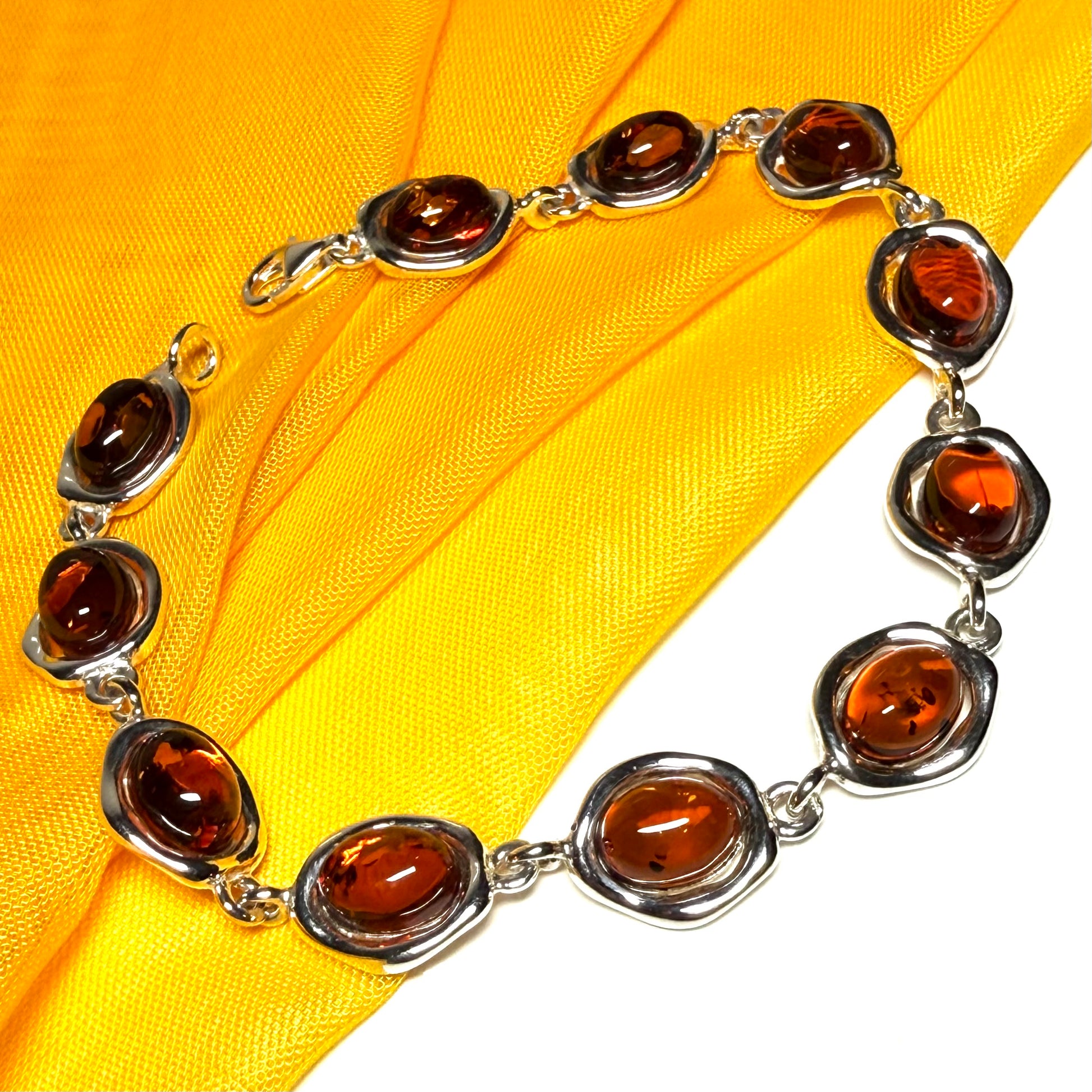 Real amber sterling silver fancy oval shaped bracelet