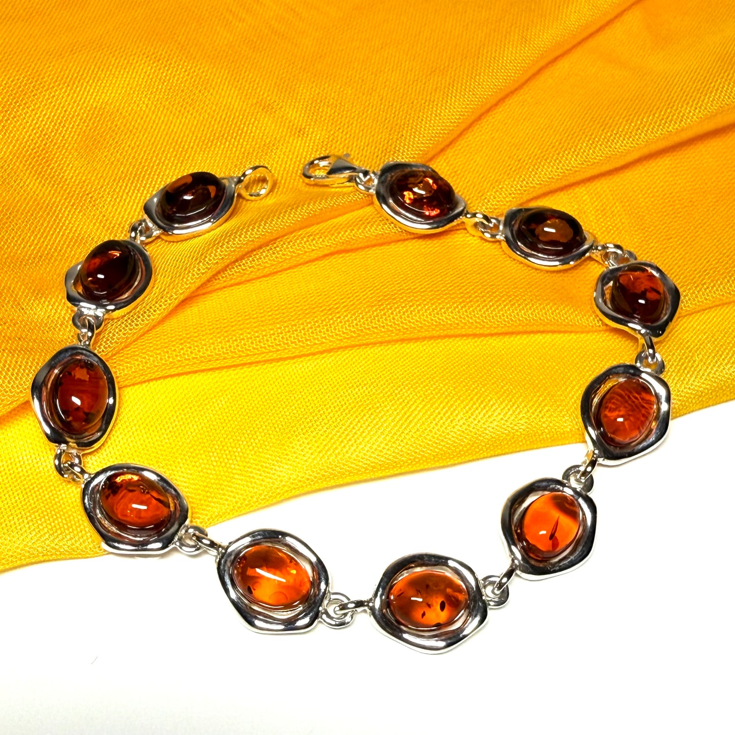 Real amber sterling silver fancy oval shaped bracelet