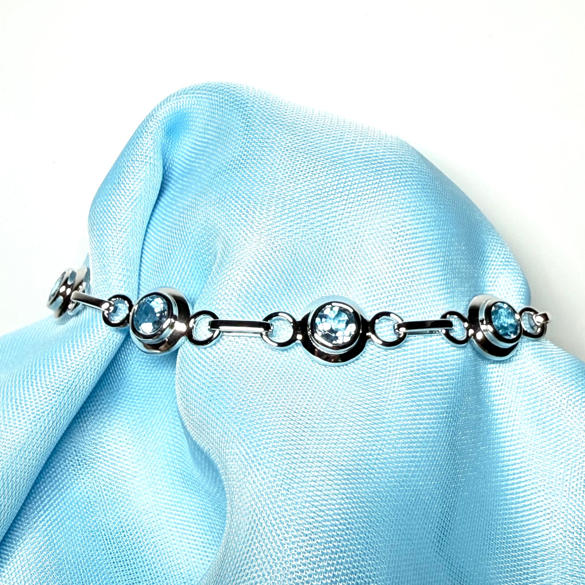 Real blue topaz fancy round link sterling silver bracelet