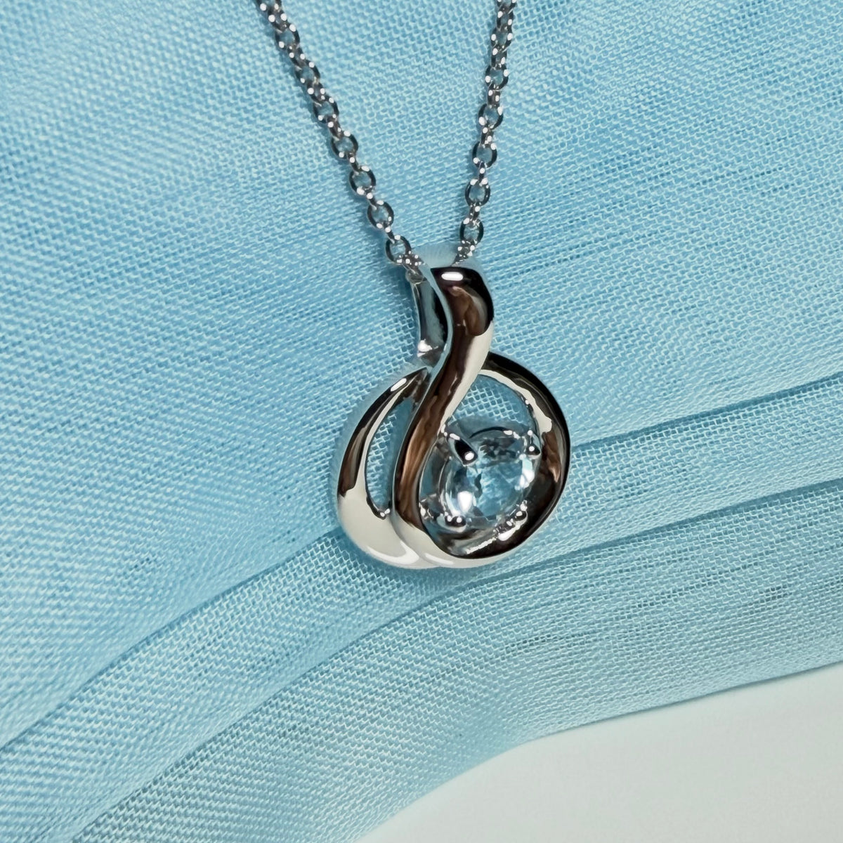 Real blue topaz necklace fancy round twisted swirl design