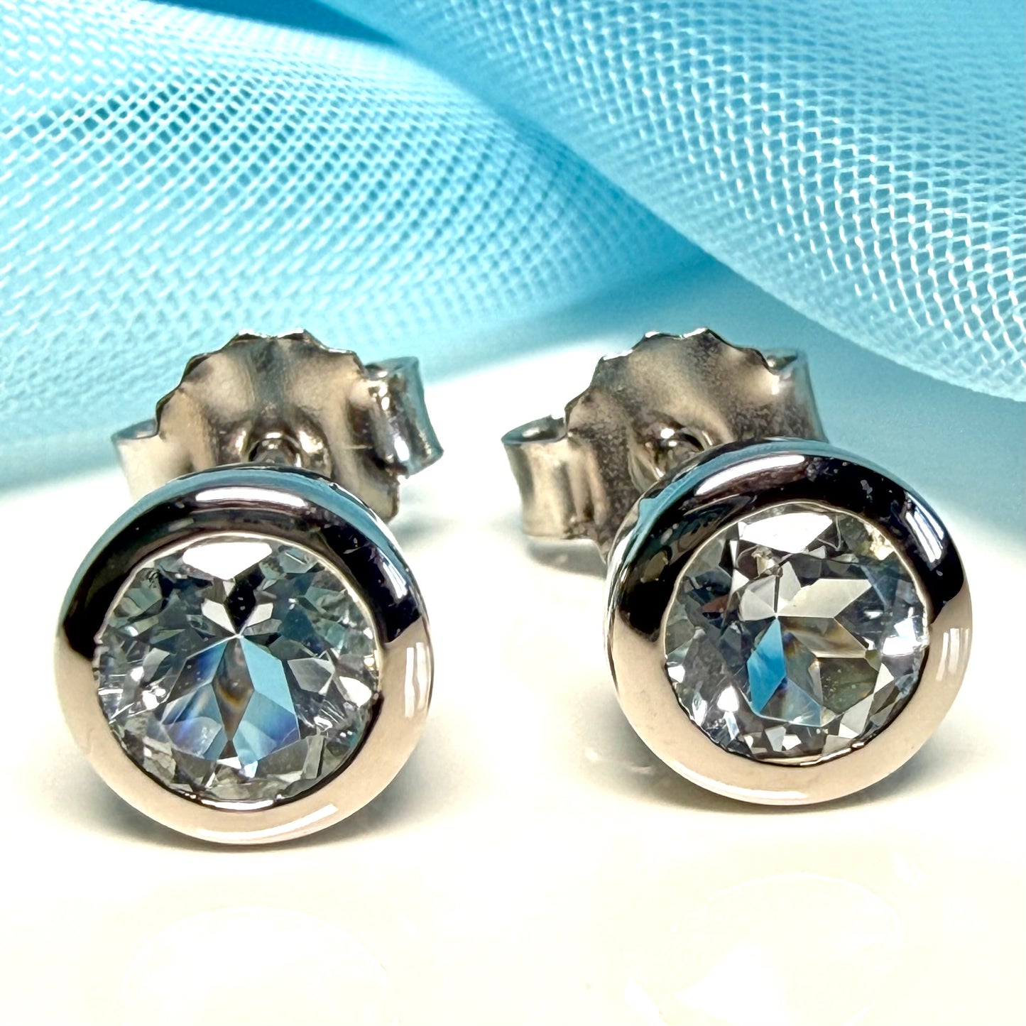 Real blue topaz round stud earrings smooth rubbed over edges