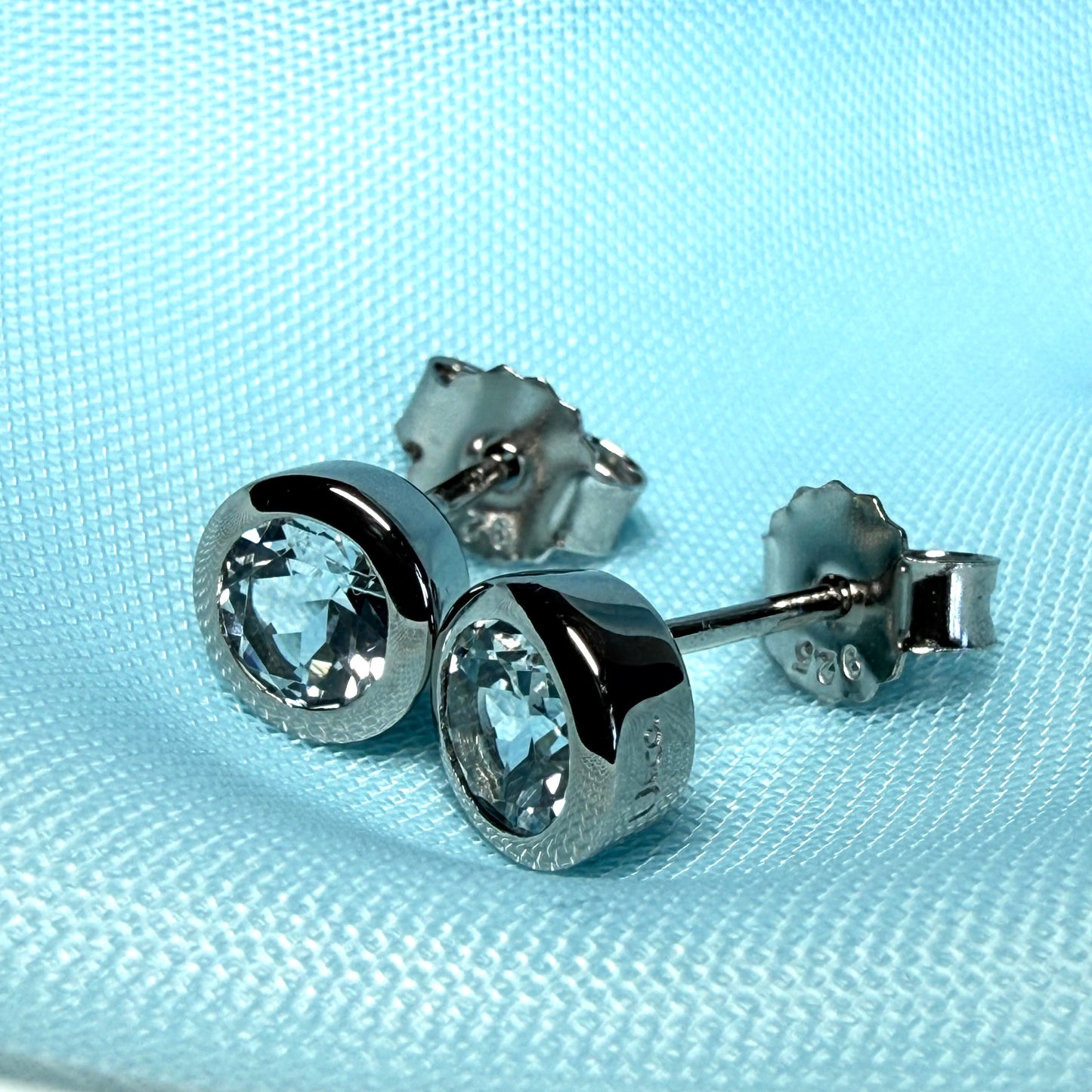 Real blue topaz round stud earrings smooth rubbed over edges