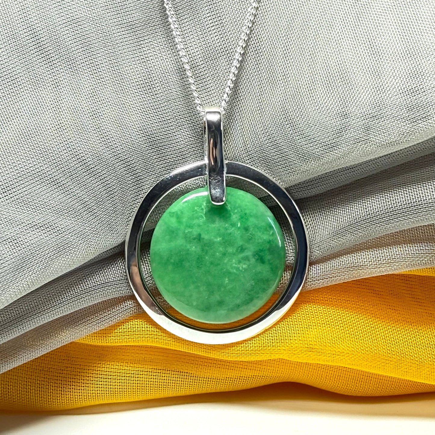 Real dark green jade necklace in a large round shape with a beautiful designed halo pendant with a chain included