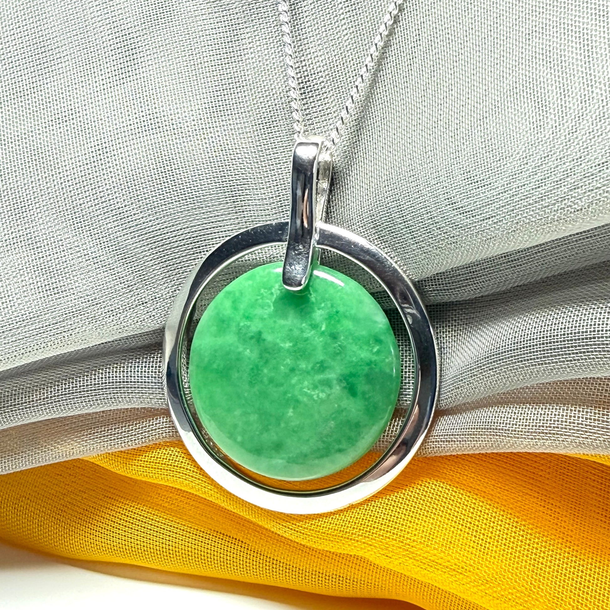 Real dark green jade necklace in a large round shape with a beautiful designed halo pendant with a chain included