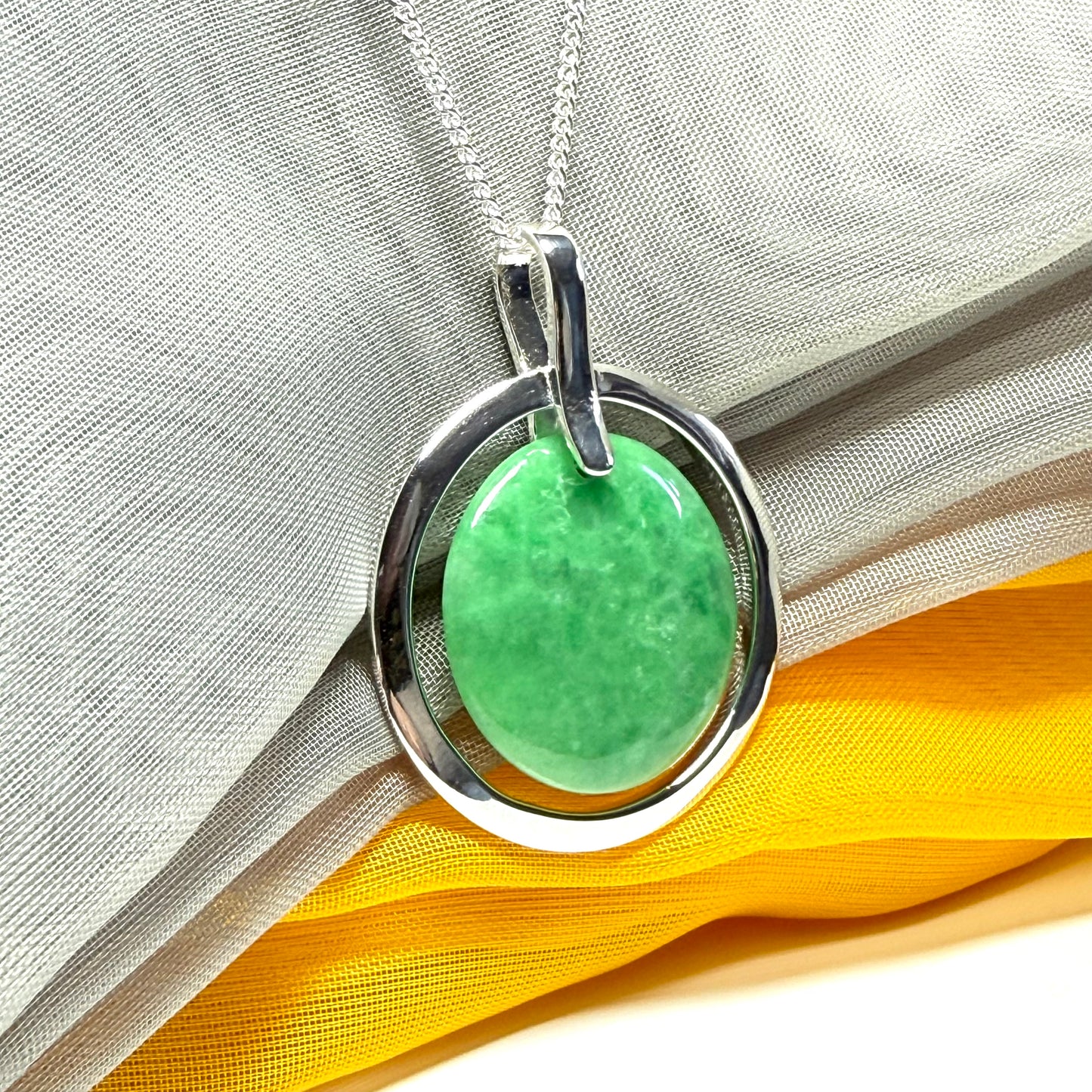 Real dark green jade necklace in a large round shape with a beautiful designed halo pendant with a chain included
