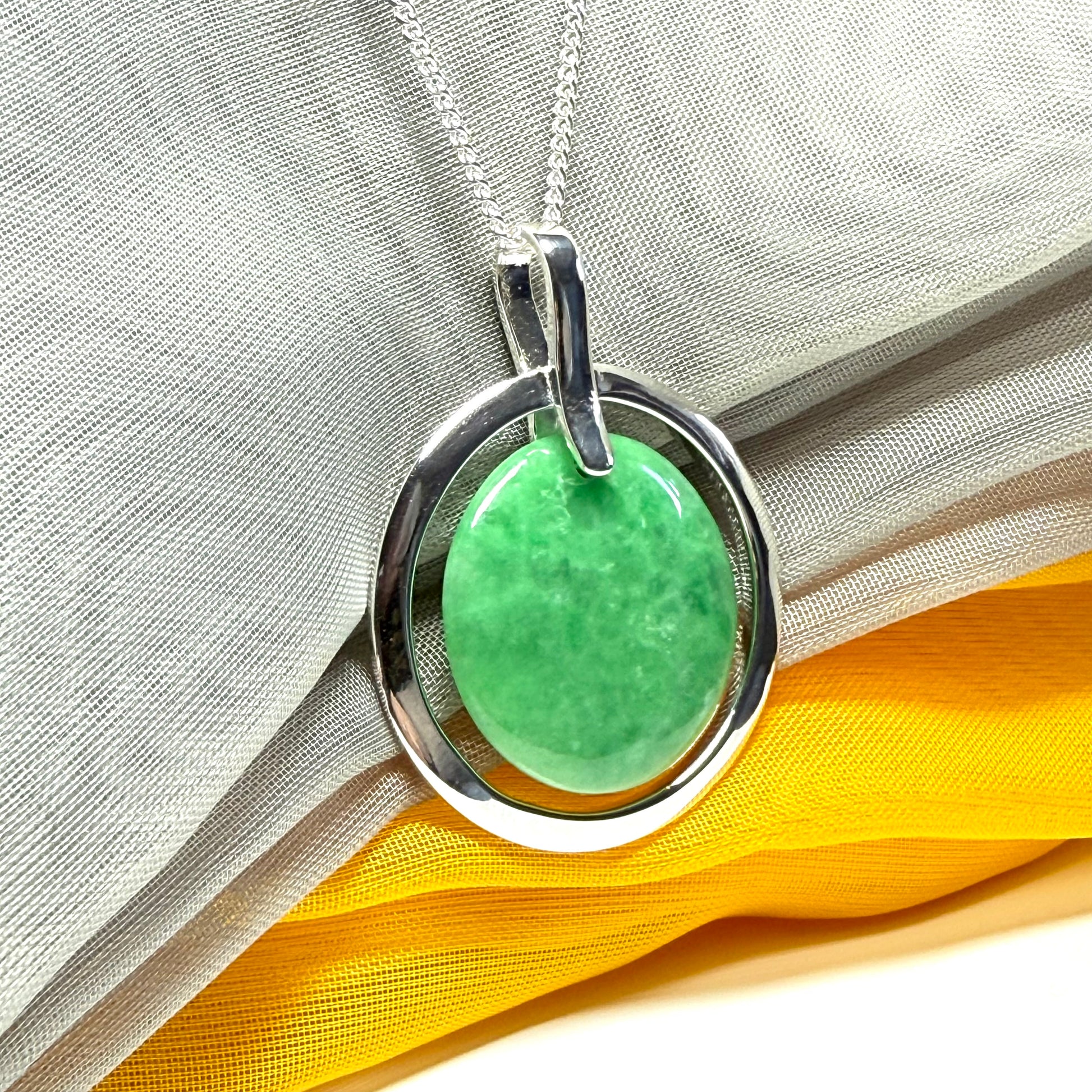 Real dark green jade necklace in a large round shape with a beautiful designed halo pendant with a chain included