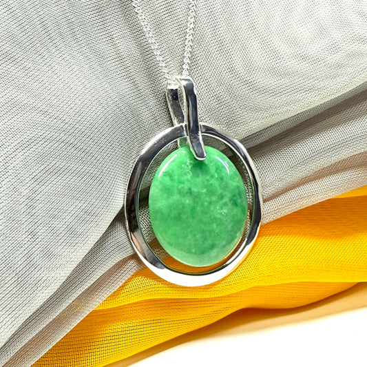 Real dark green jade necklace in a large round shape with a beautiful designed halo pendant with a chain included
