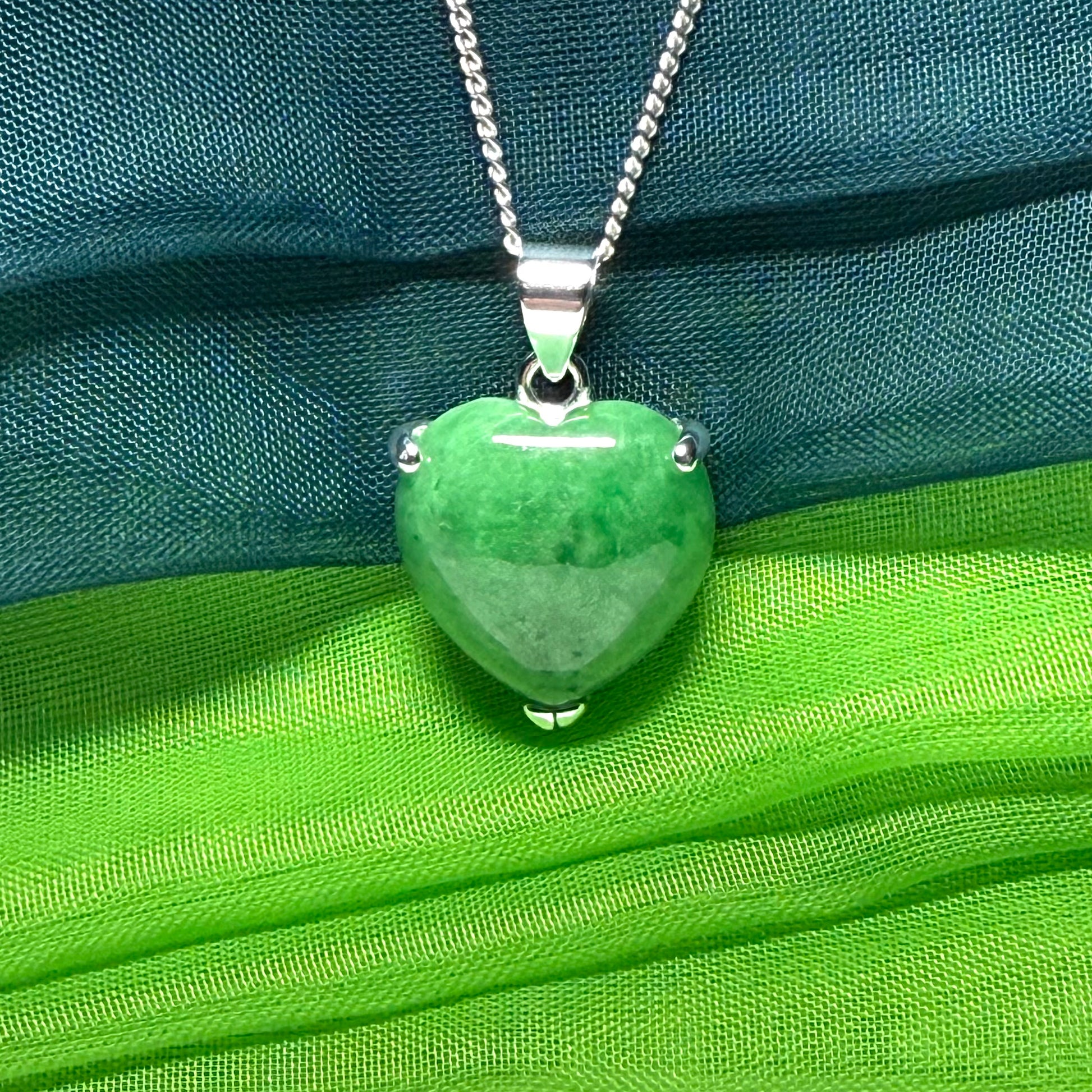 A real dark green jade pendant necklace heart shape sterling silver and a chain