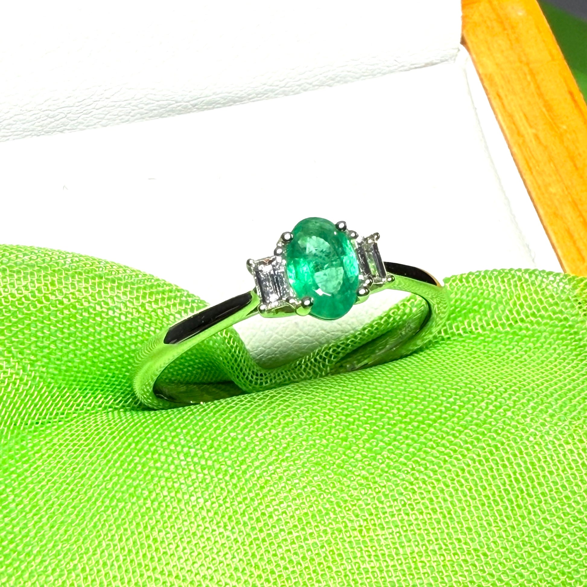 Real emerald and diamond three stone trilogy ring white gold