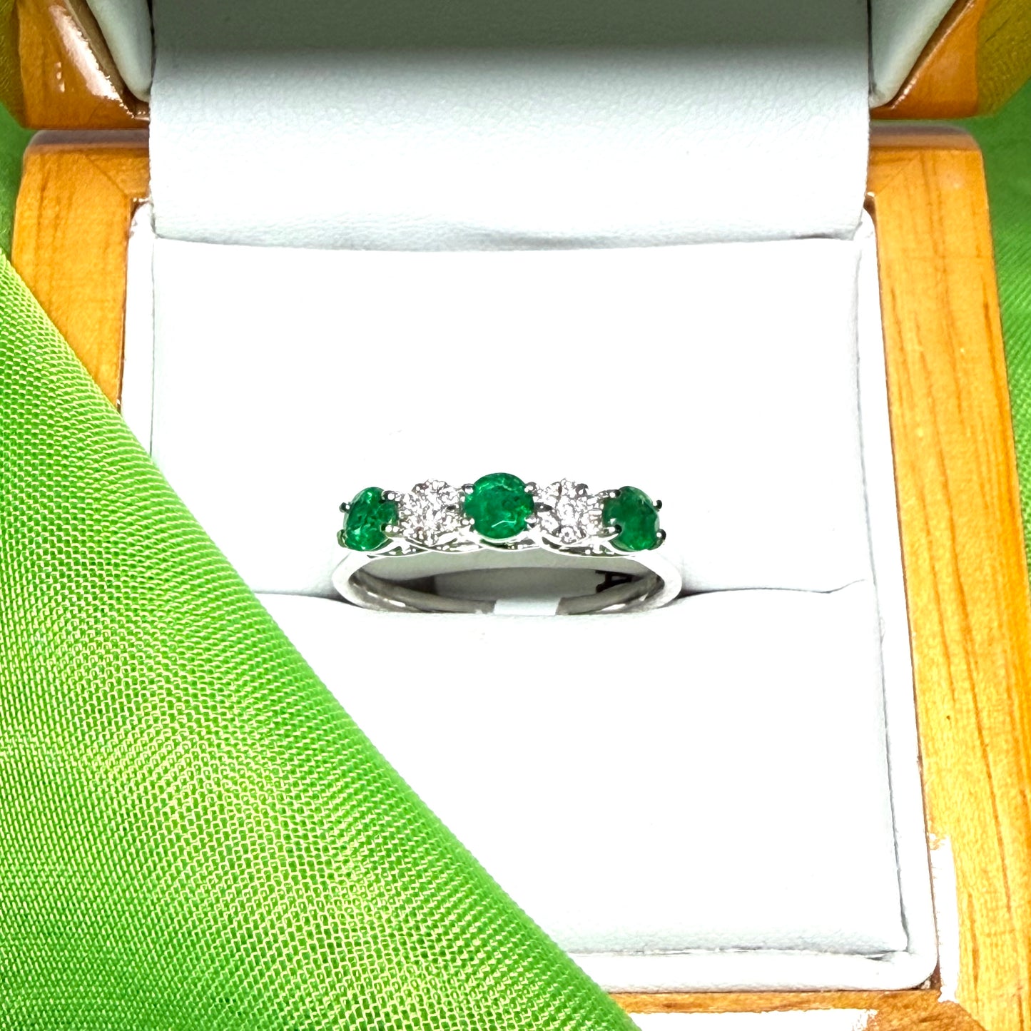 Real emerald and diamond white gold eternity ring claw setting