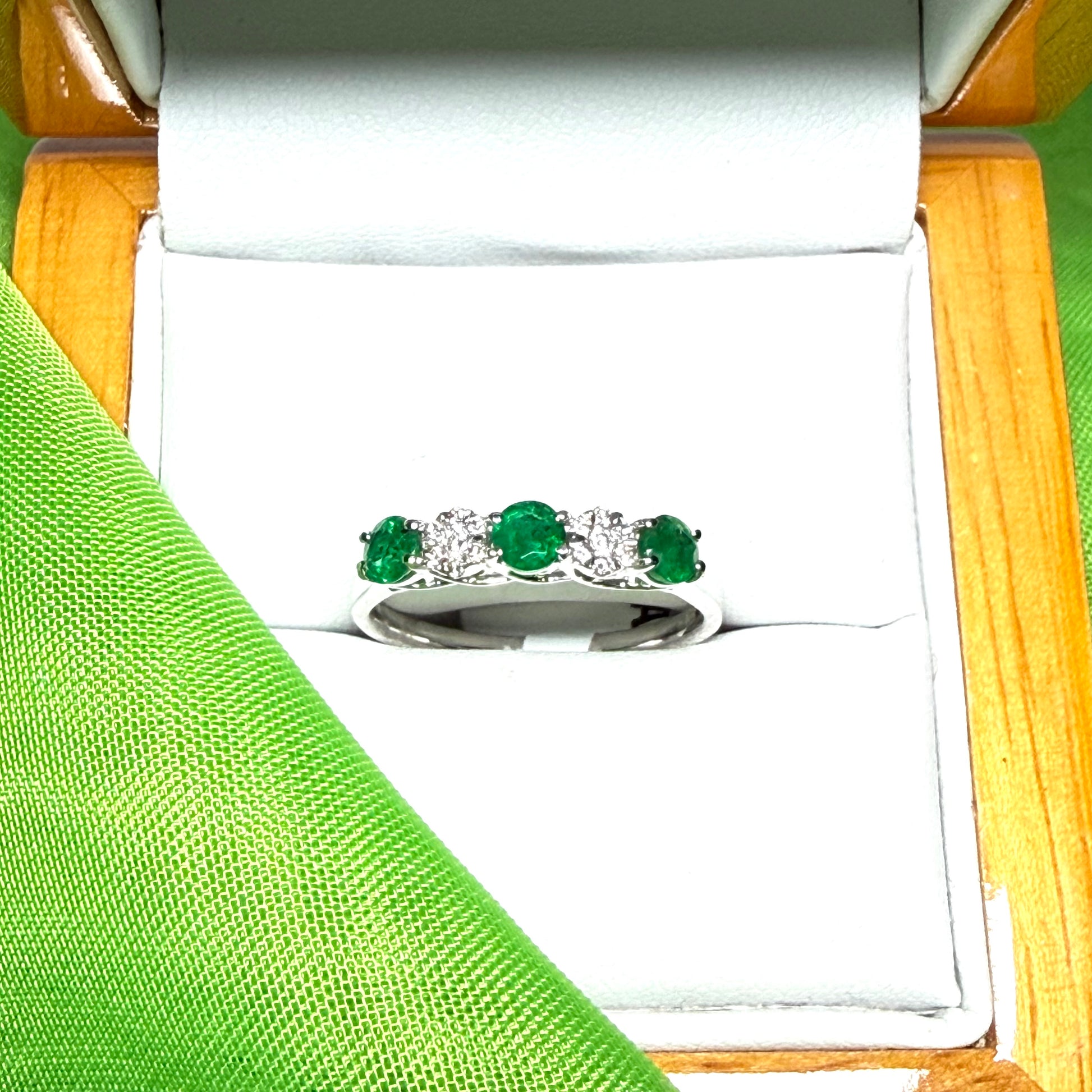Real emerald and diamond white gold eternity ring claw setting