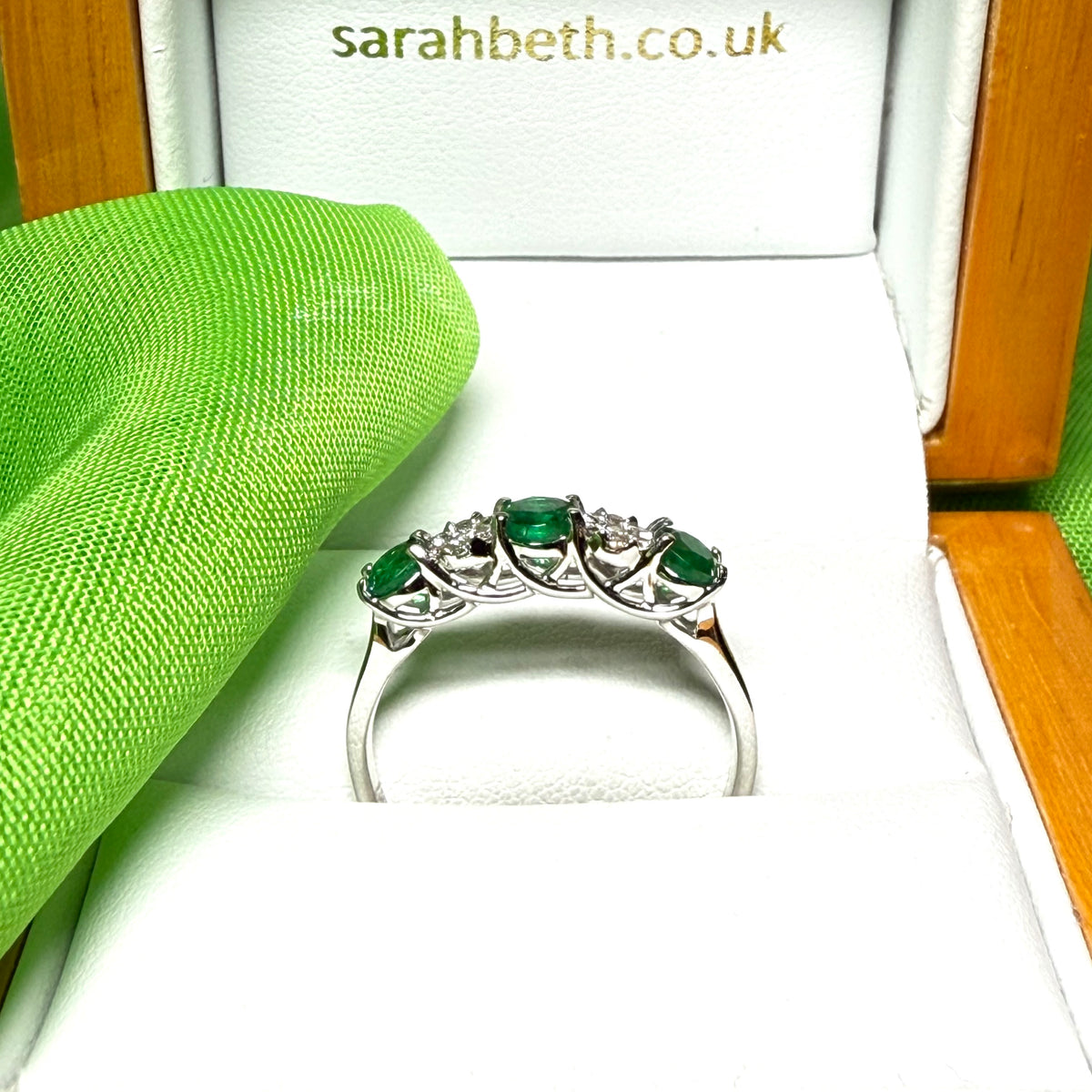 Real emerald and diamond white gold eternity ring claw setting