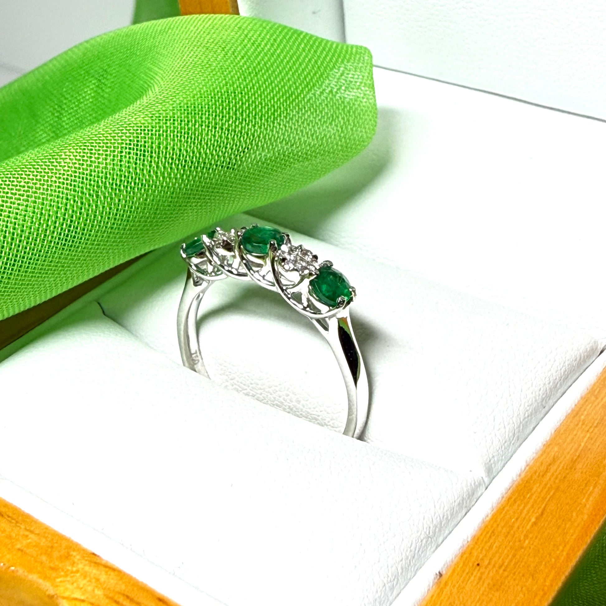 Real emerald and diamond white gold eternity ring claw setting
