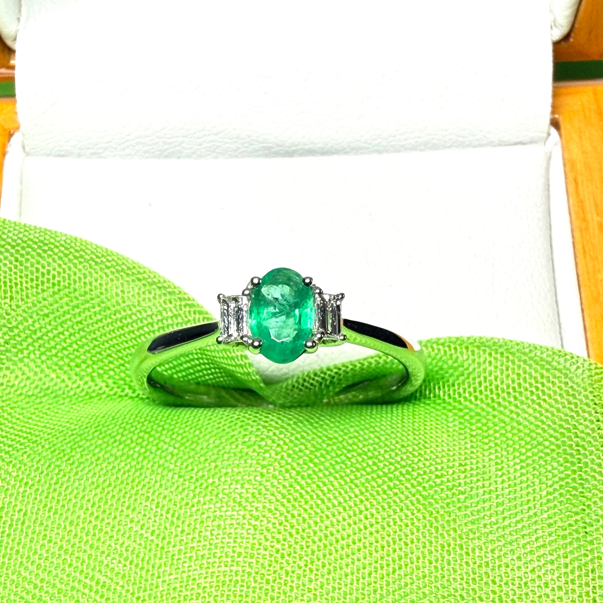 Real emerald and diamond three stone trilogy ring white gold
