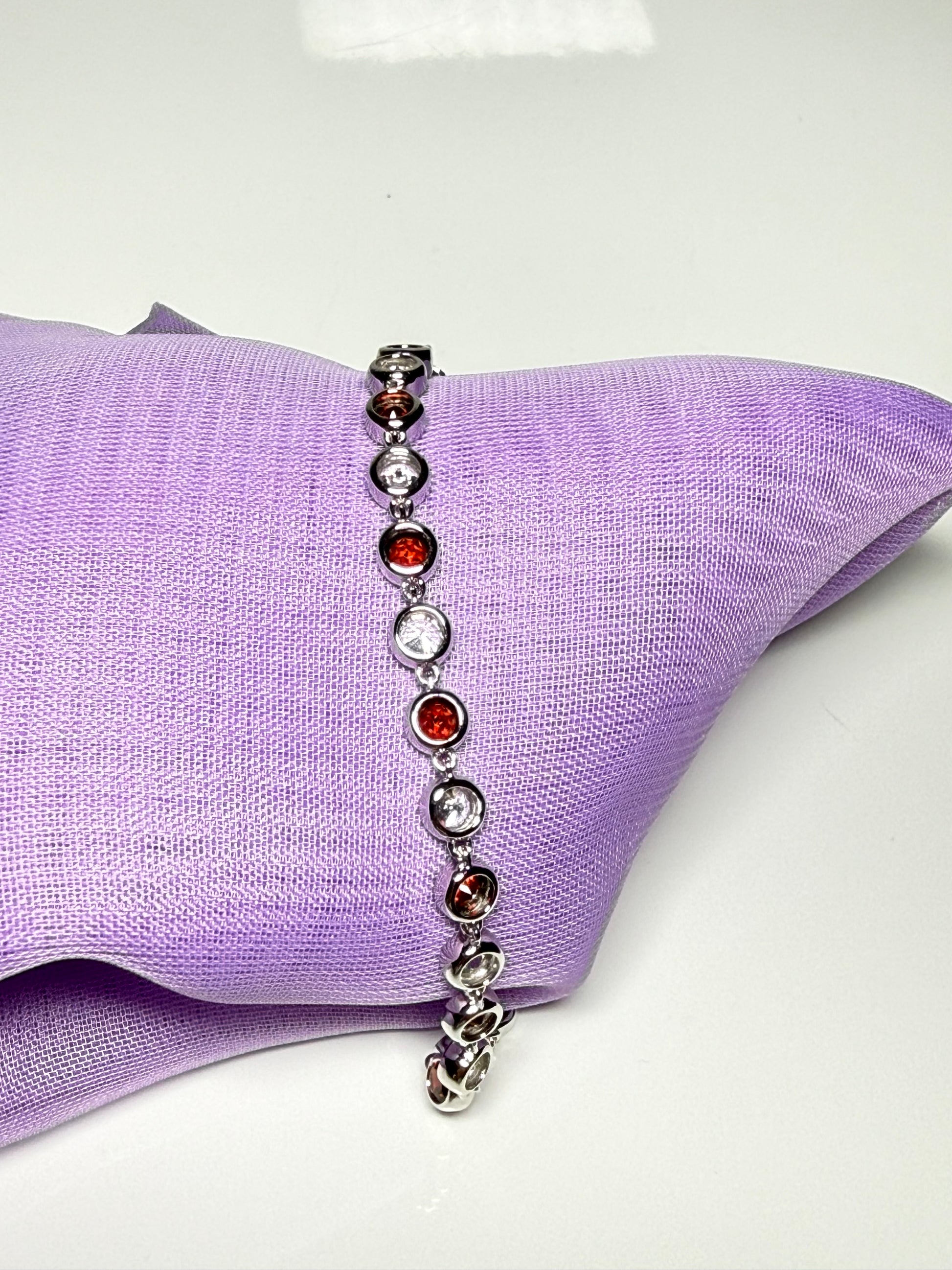Real garnet and cubic zirconia round sterling silver bracelet