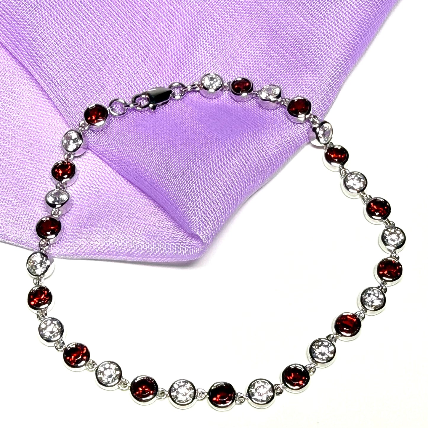 Real garnet and cubic zirconia round sterling silver bracelet