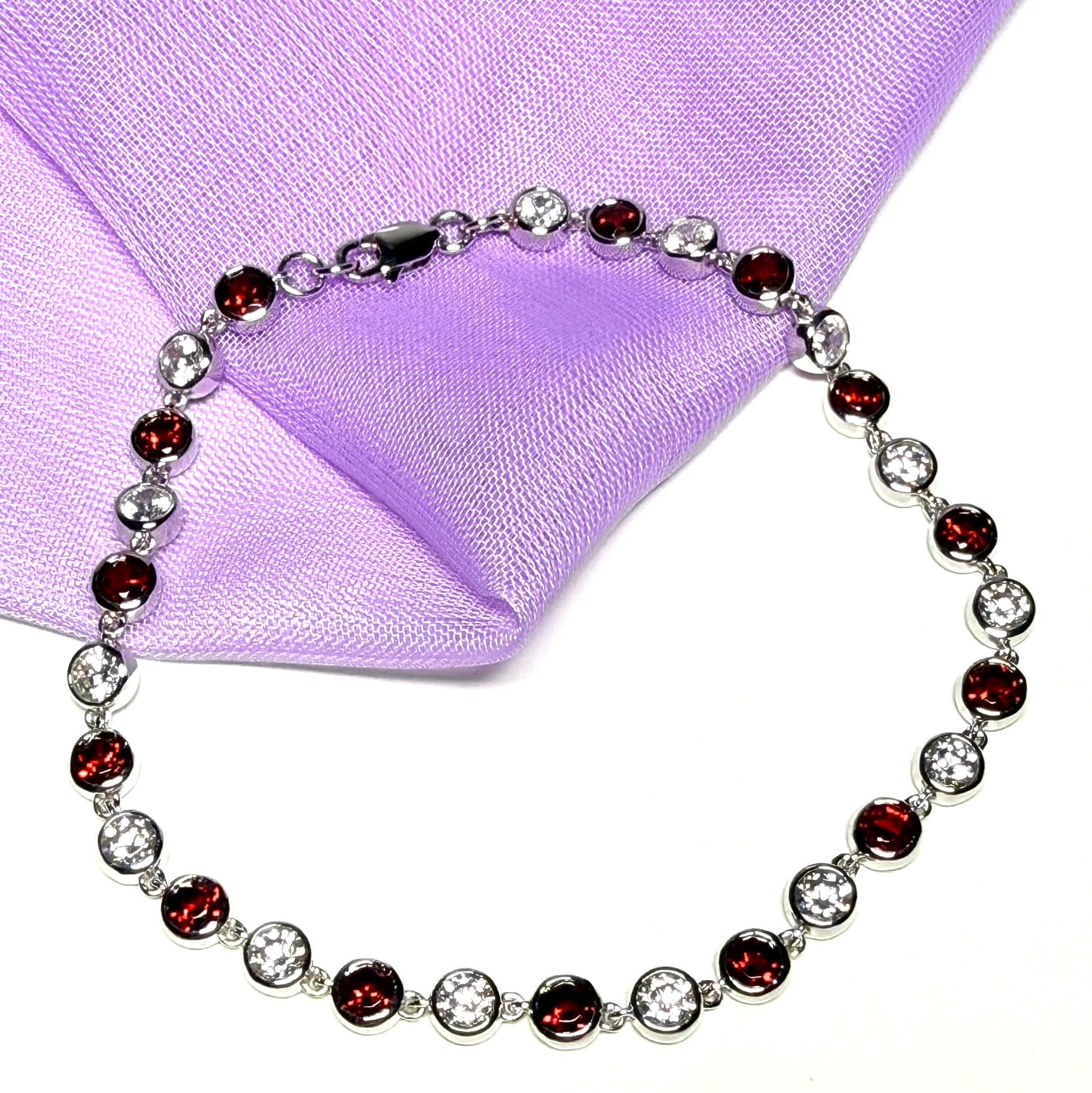 Real garnet and cubic zirconia round sterling silver bracelet