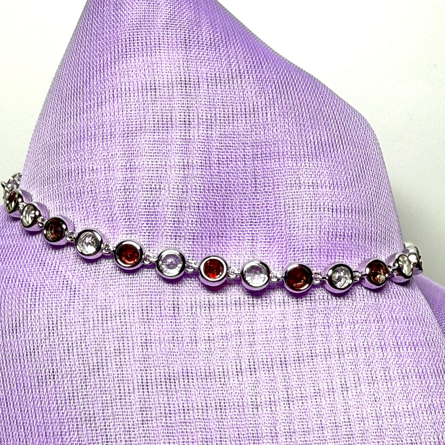 Real garnet and cubic zirconia round sterling silver bracelet