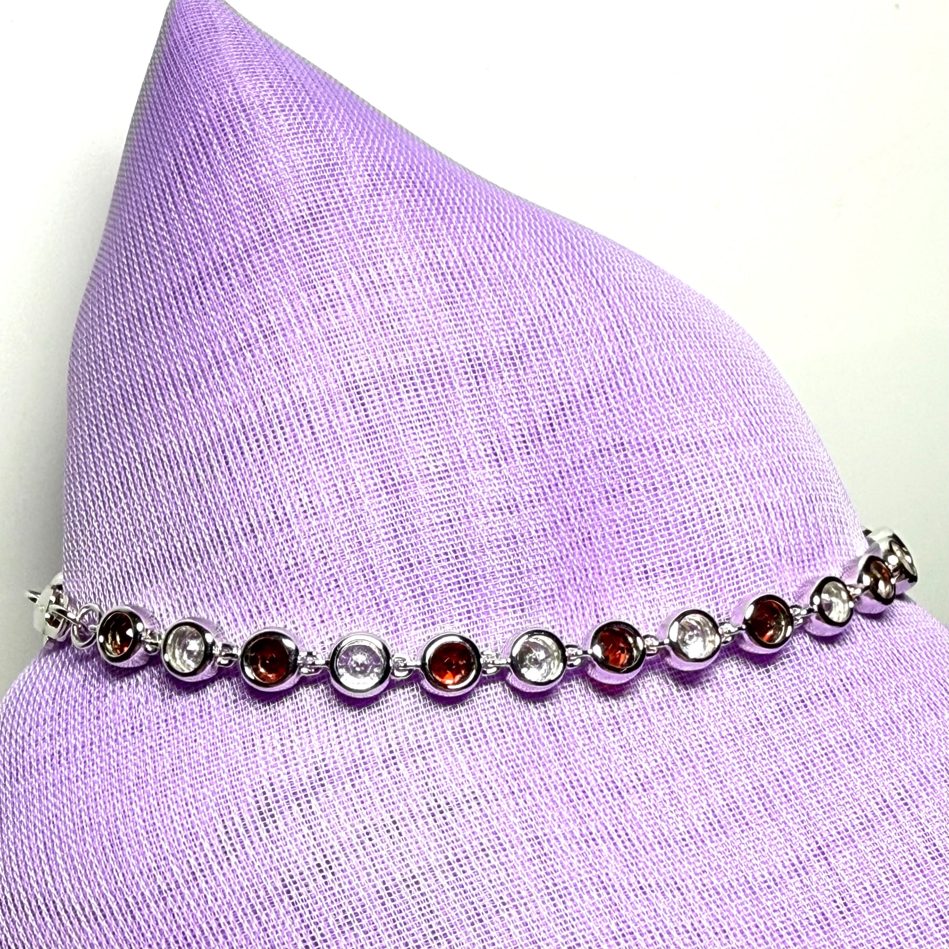 Real garnet and cubic zirconia round sterling silver bracelet
