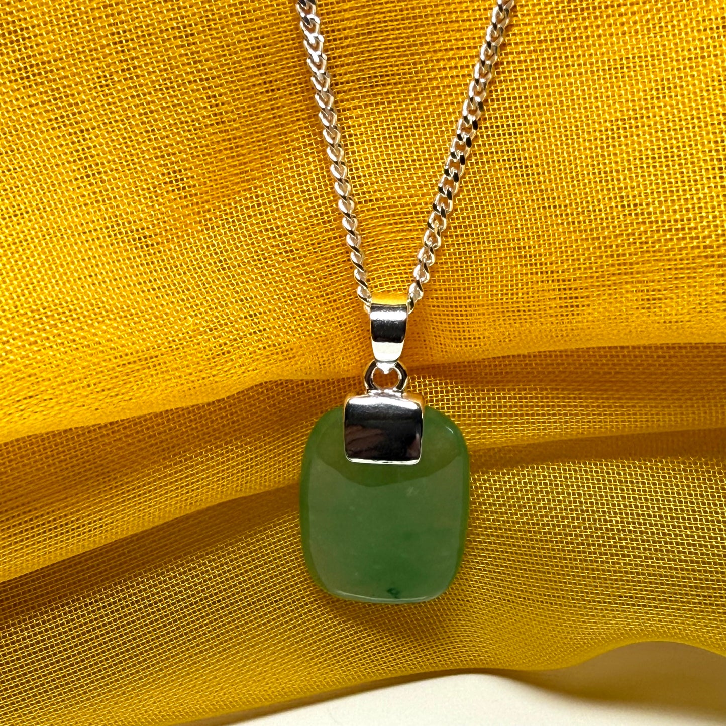 Real green jade necklace cushion shaped silver with a chain, truly stunning pendant