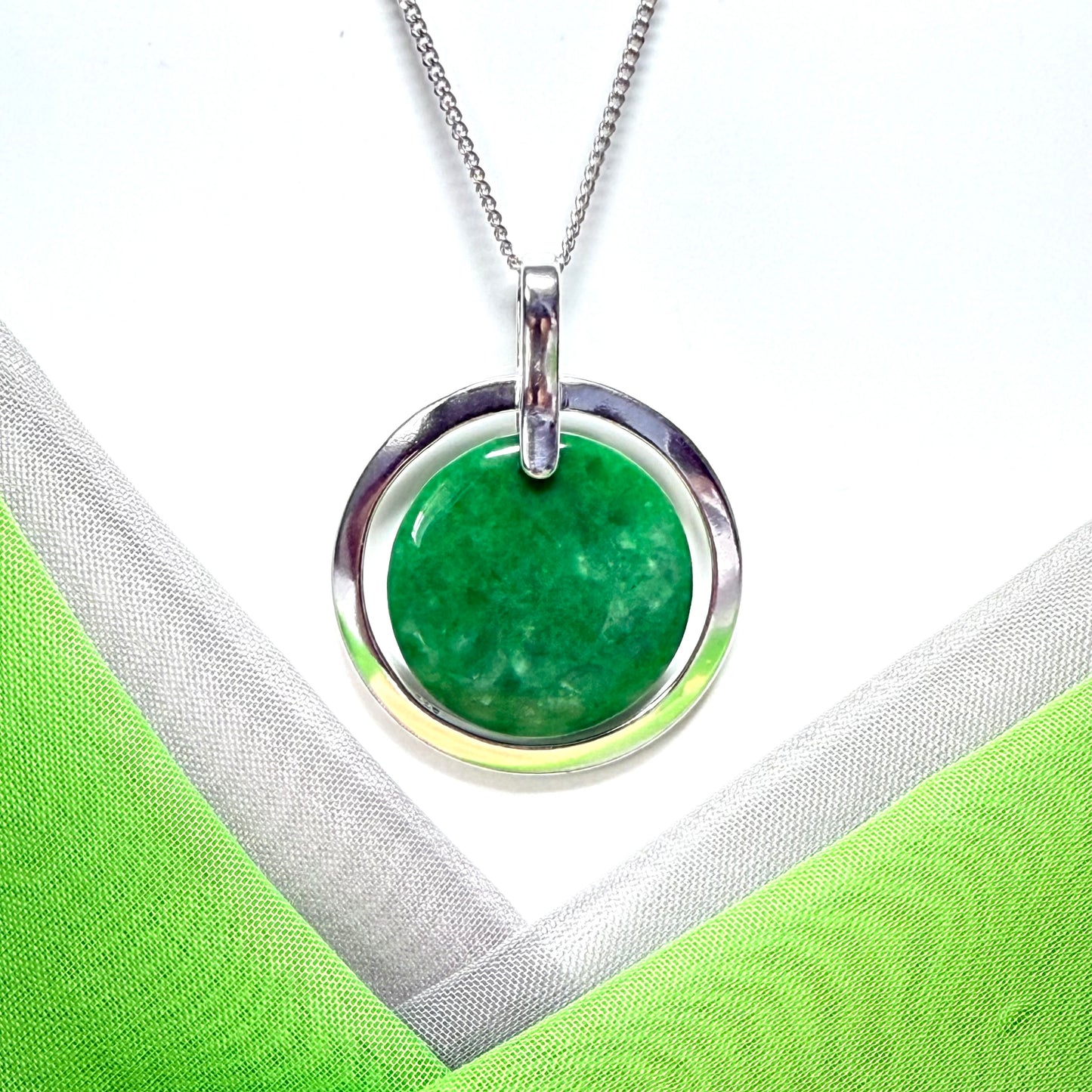Real green jade necklace in a large round shape with a beautiful designed halo pendant with chain