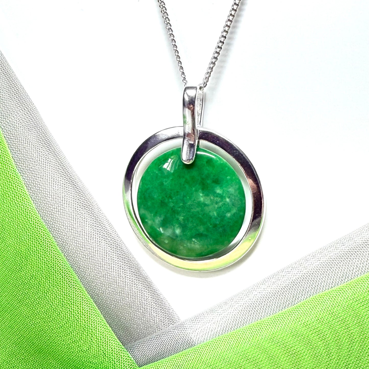 Real green jade necklace in a large round shape with a beautiful designed halo pendant with chain