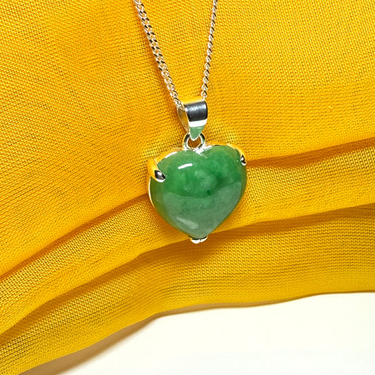 A real green jade necklace heart shape sterling silver pendant including chain