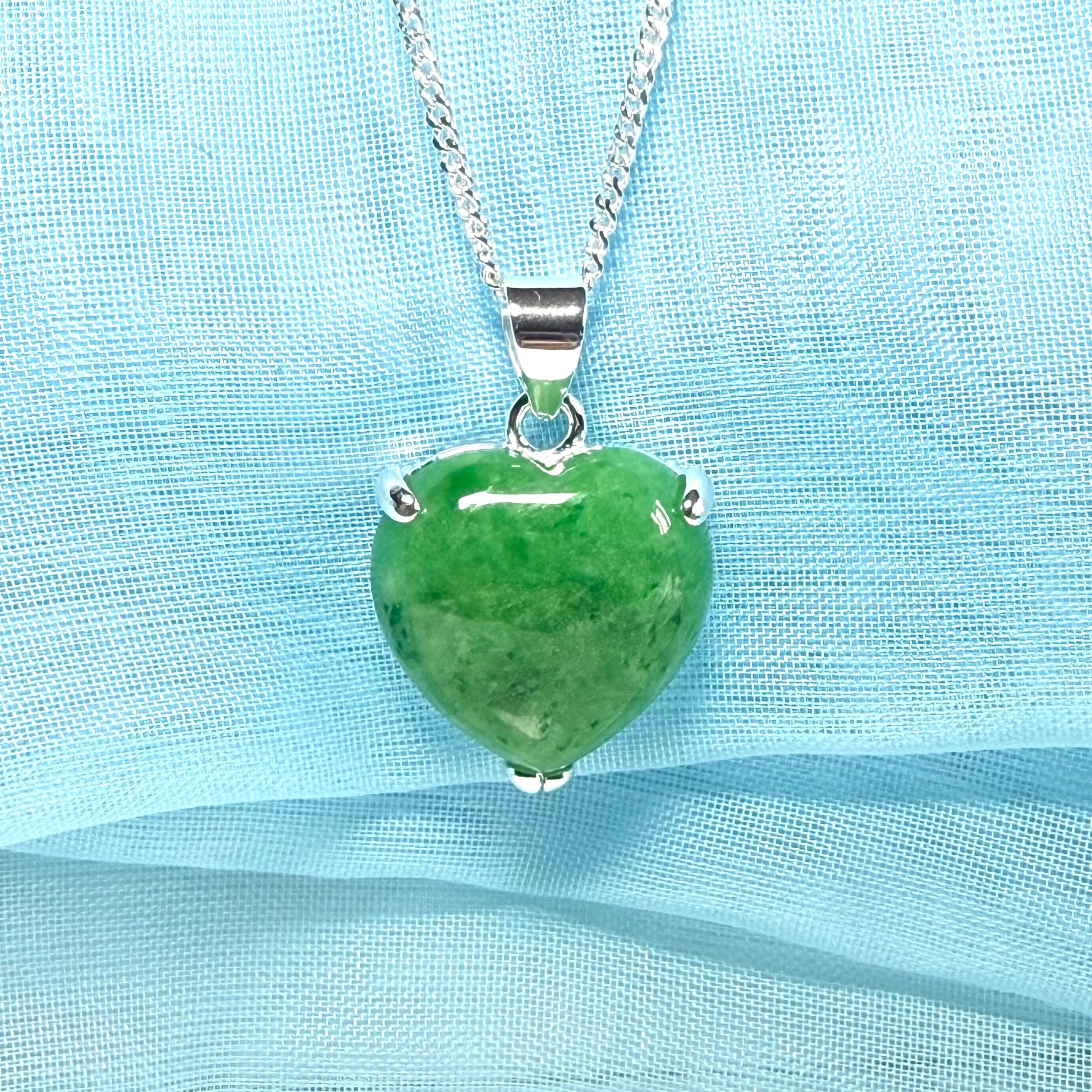 A real green jade necklace heart shape sterling silver with solid chain and box included as well
