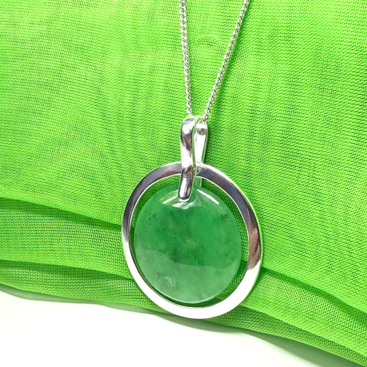 Real green jade necklace in a large round shape with a beautiful designed halo pendant with chain, whispers of green