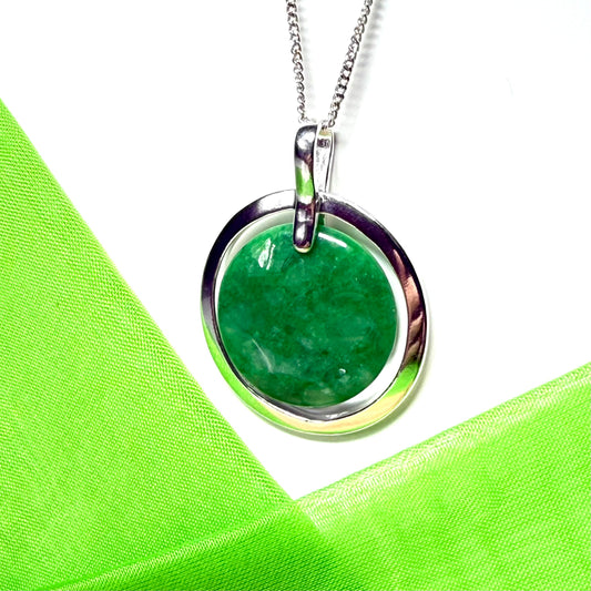 Real green jade necklace in a large round shape with a beautiful designed halo pendant, with whispers of green