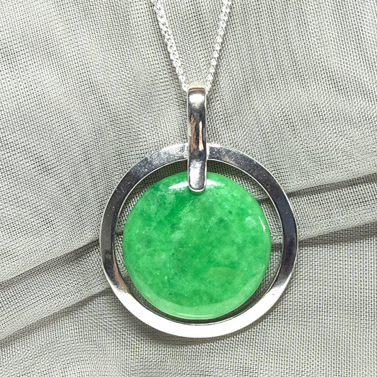 Real green jade necklace in a large round shape with a stunning designed halo pendant