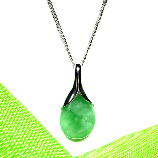 Real green jade necklace in a pear or tear drop shaped sterling silver pendant with chain