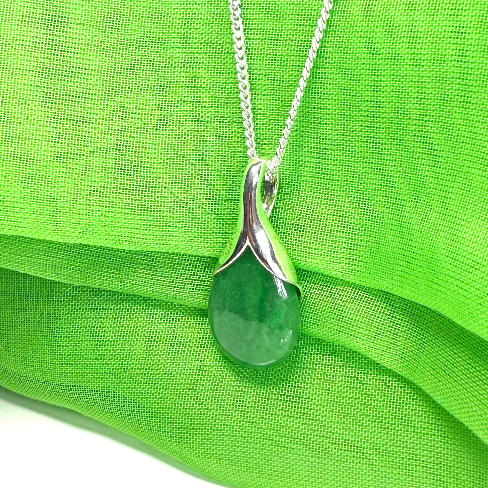 Real green jade necklace in a pear shaped sterling silver pendant