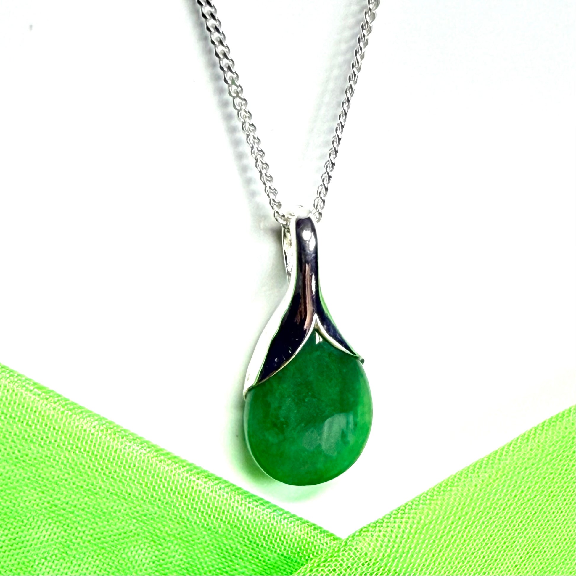Real green jade necklace in a pear shaped sterling silver pendant