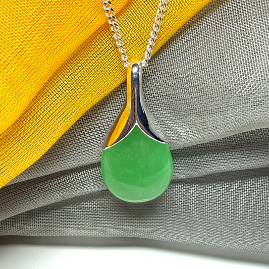 Real green jade necklace in a teardrop or pear shaped, timeless designed pendant with a chain