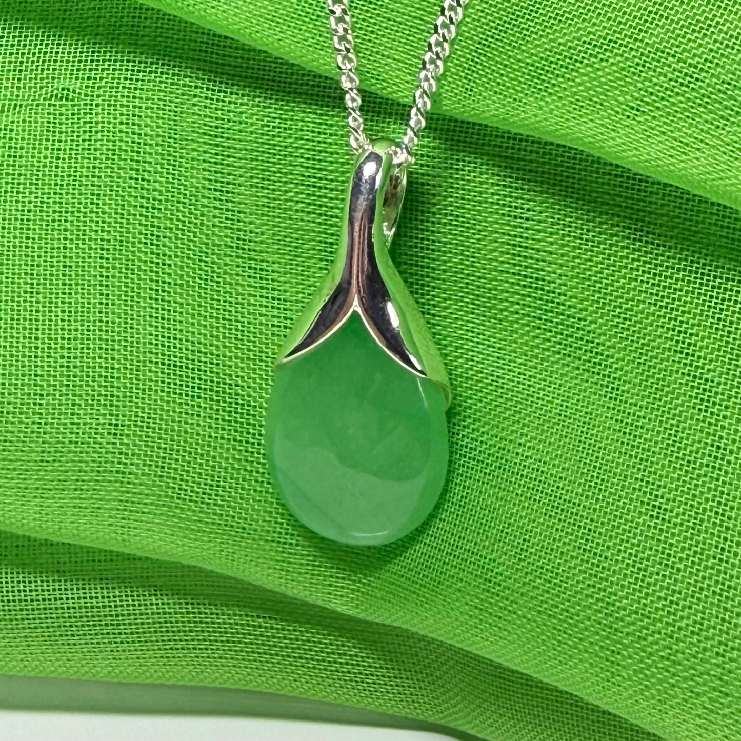 Real green jade necklace in a teardrop with pear shape, a timeless designed pendant with a chain included