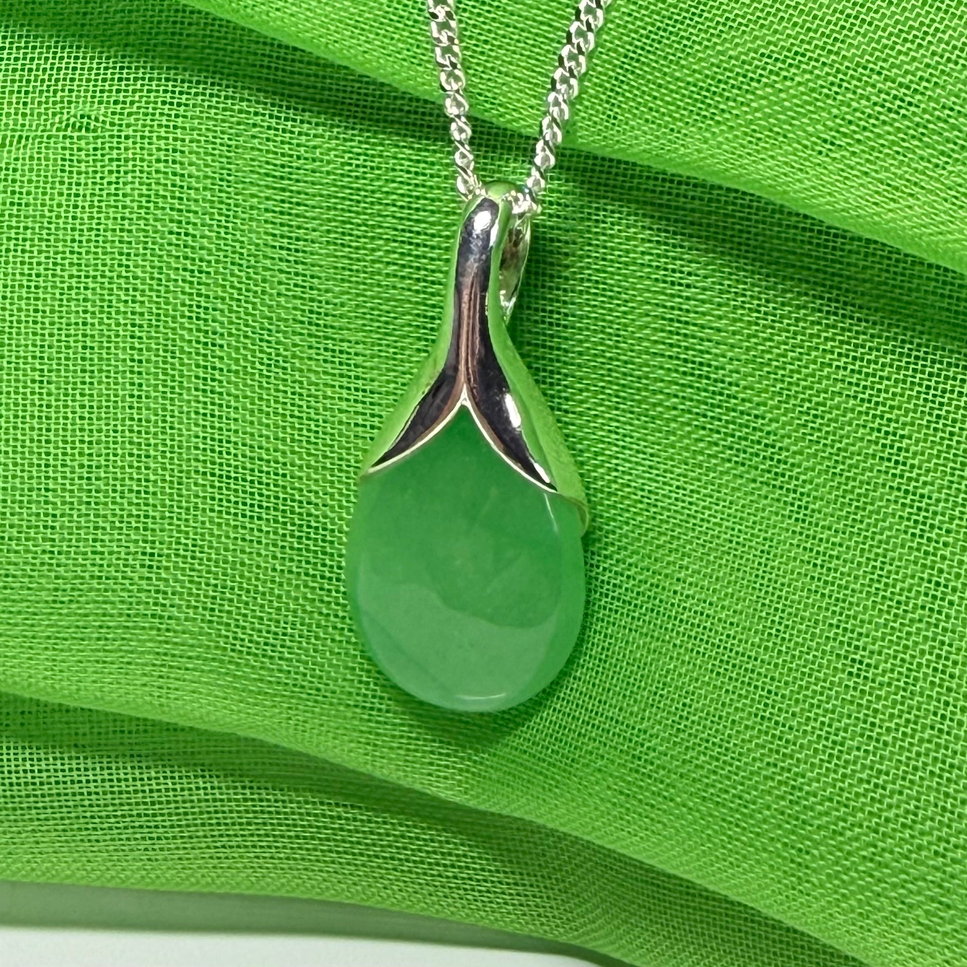 Real green jade necklace in a teardrop with pear shape, a timeless designed pendant with a chain included