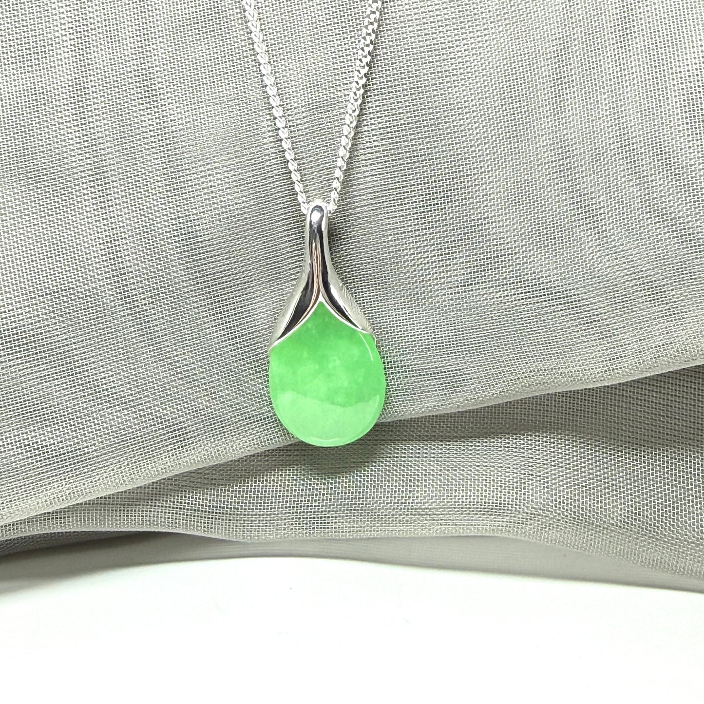 Real green jade necklace in a teardrop or pear shaped, a simply stunning pendant
