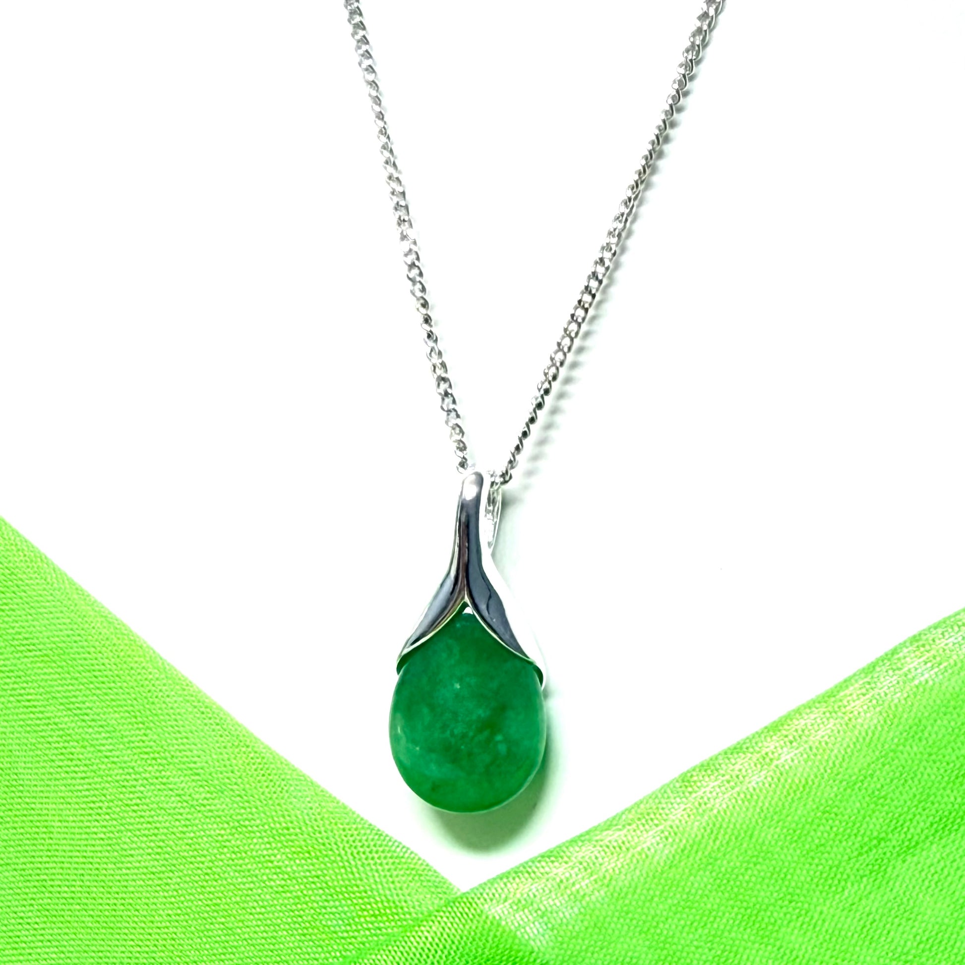 Real green jade necklace in a teardrop or pear shaped, a timeless designed pendant with a chain