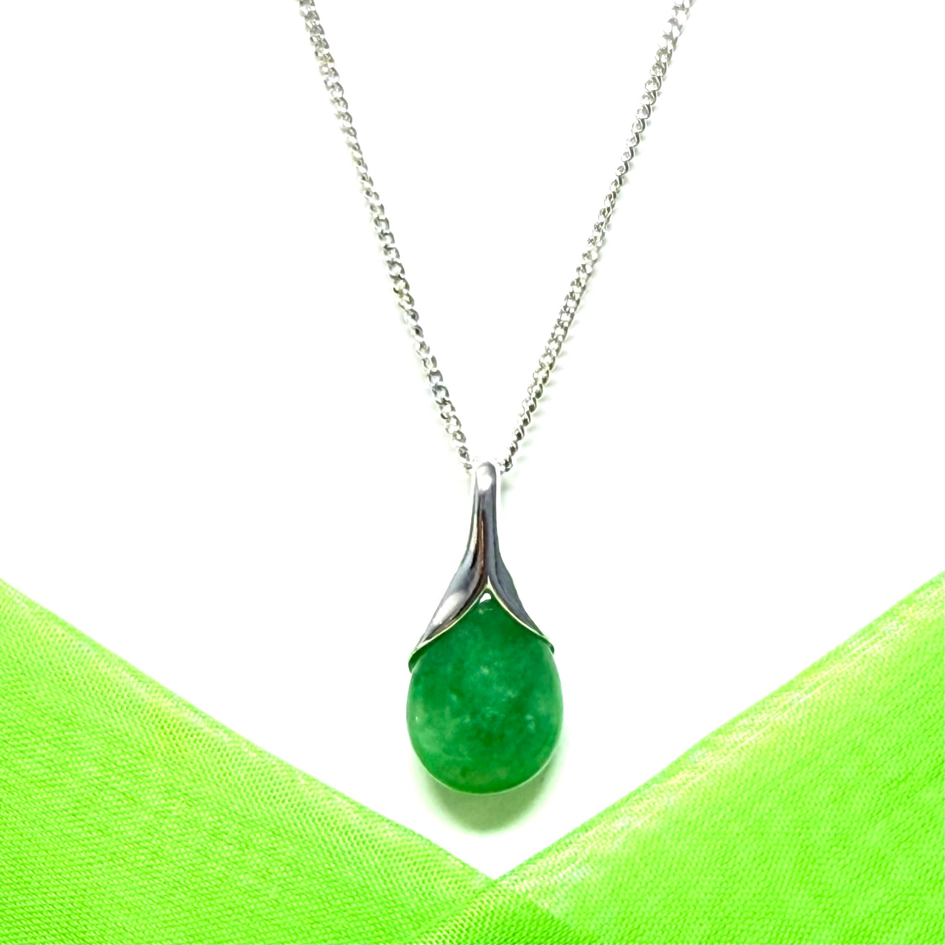 Real green jade necklace in a teardrop or pear shaped, a timeless designed pendant with a chain
