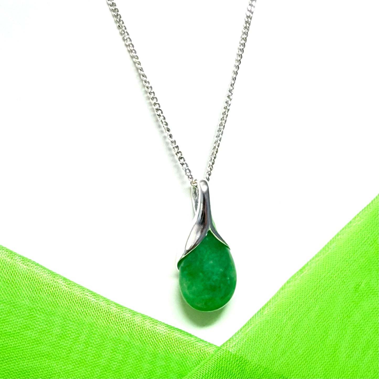 Real green jade necklace in a teardrop or pear shaped, a timeless designed pendant with a chain