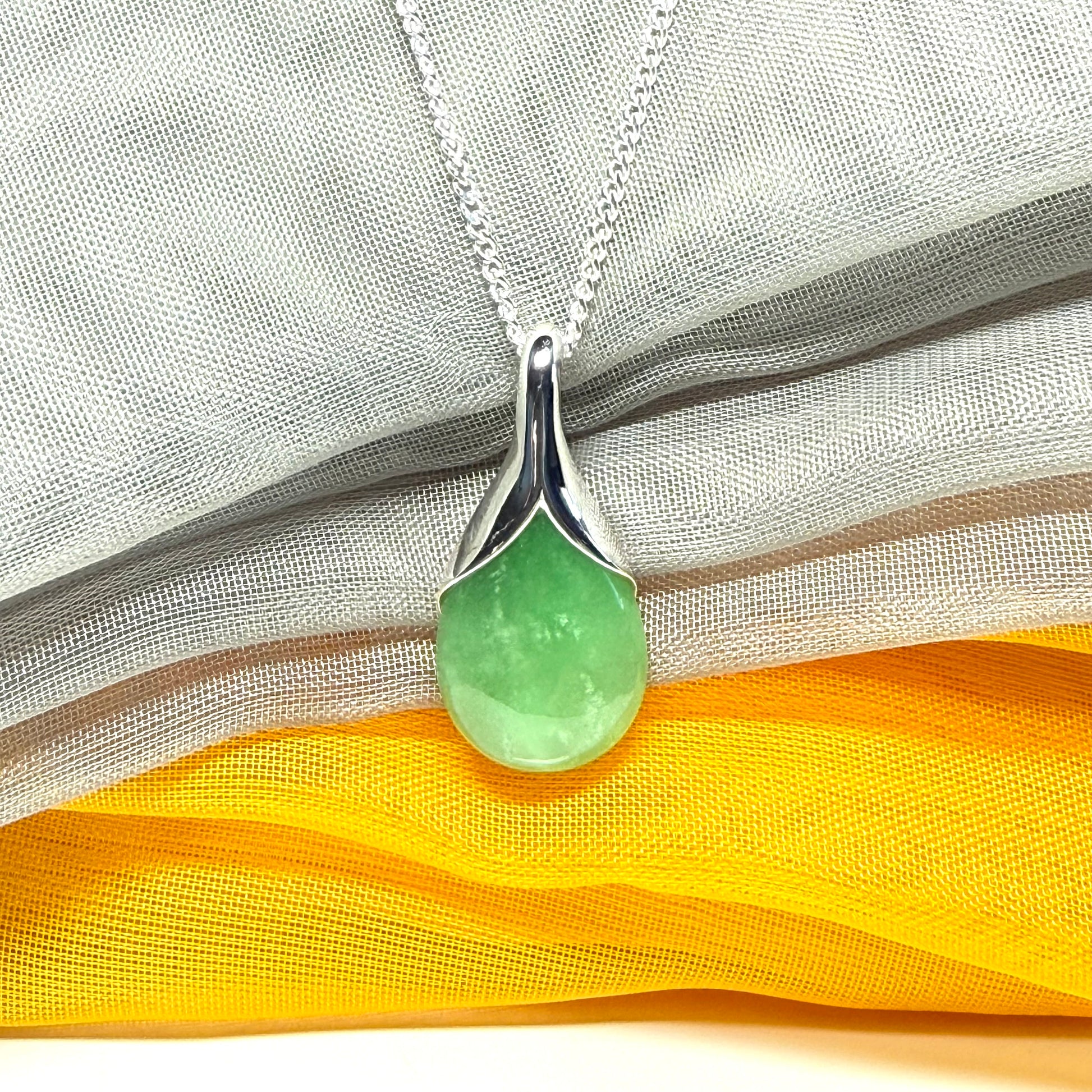 Real green jade necklace in a teardrop or pear shaped, simply stunning