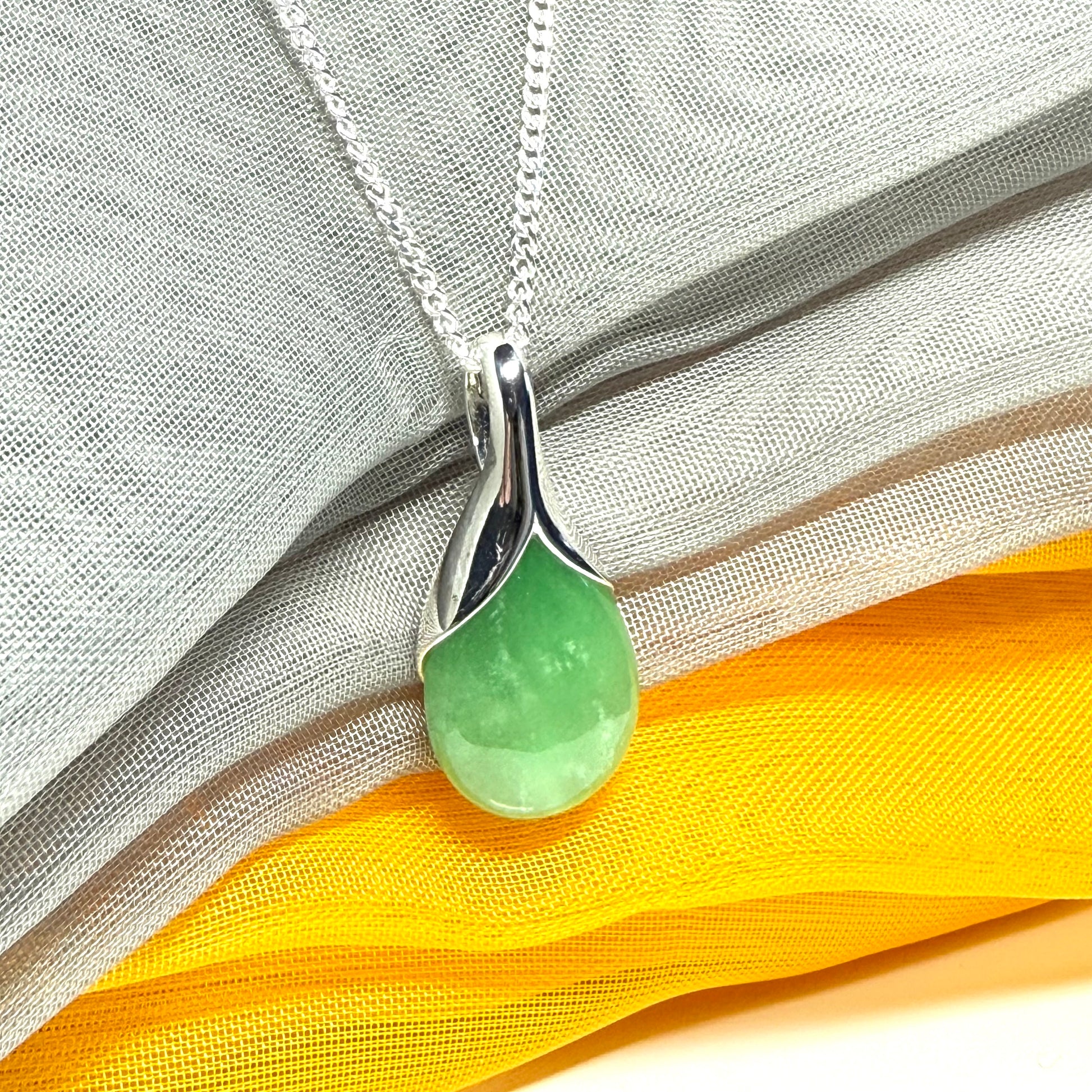 Real green jade necklace in a teardrop or pear shaped, simply stunning