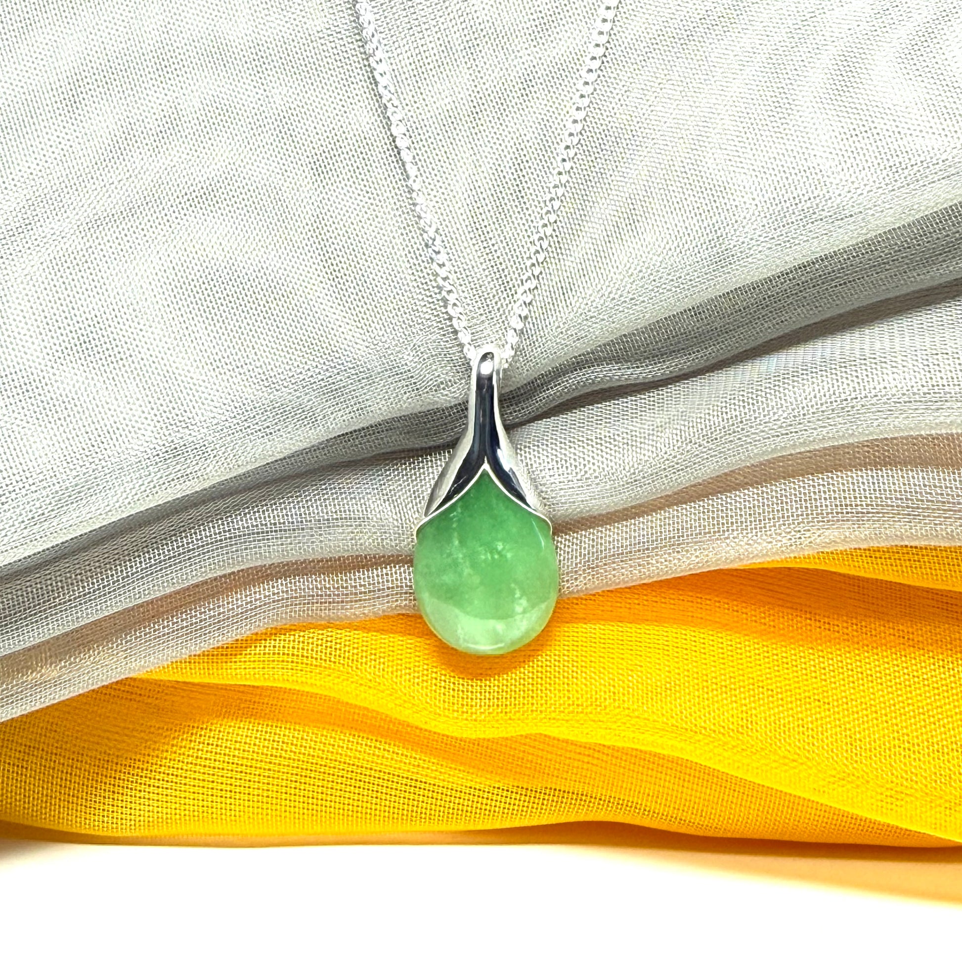 Real green jade necklace in a teardrop or pear shaped, simply stunning
