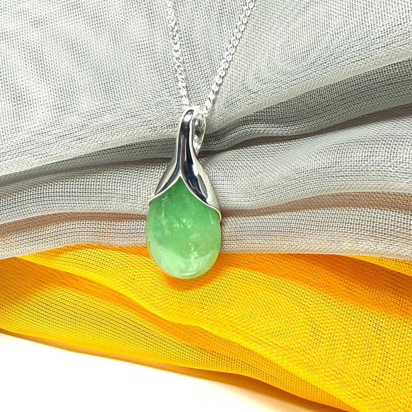 Real green jade necklace in a teardrop or pear shaped, simply stunning