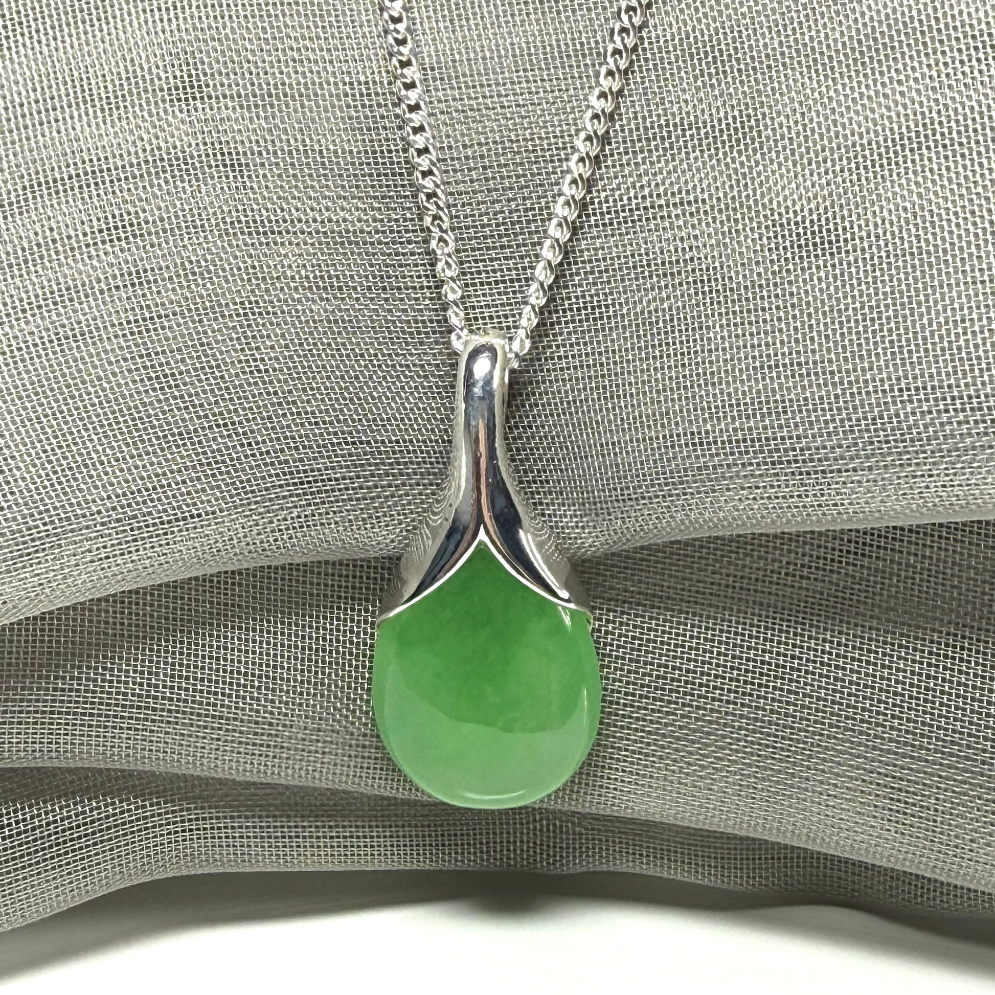 Real green jade necklace in a teardrop or pear shaped, timeless designed pendant solid chain