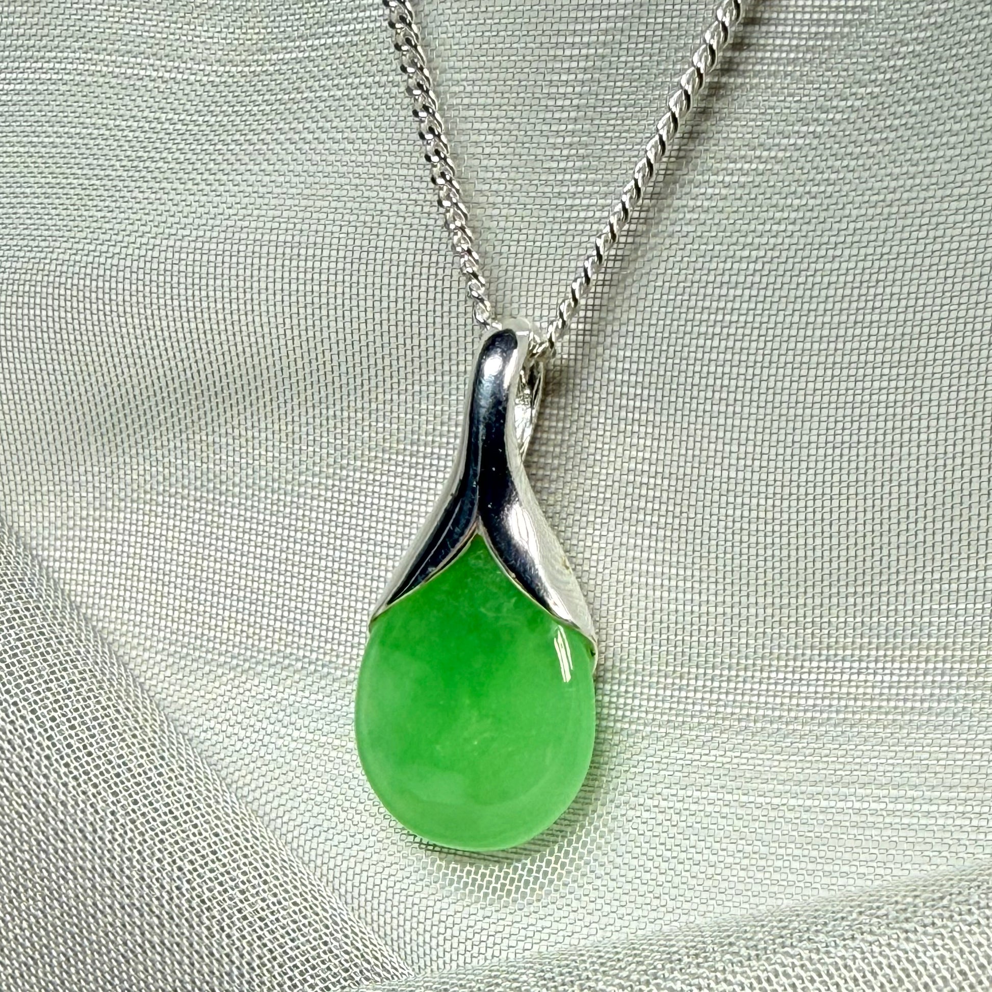 Real green jade necklace in a teardrop or pear shaped, timeless designed pendant solid chain