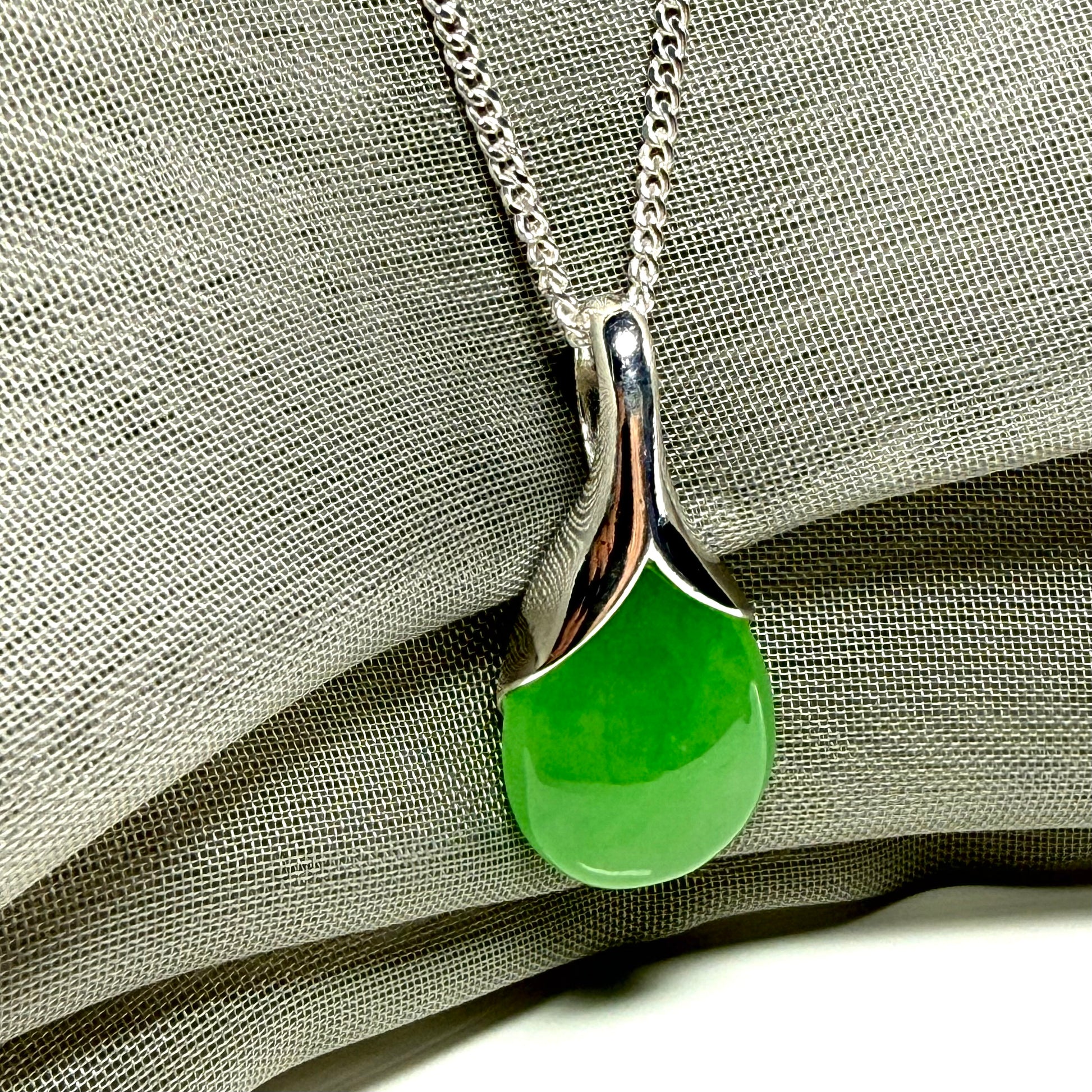 Real green jade necklace in a teardrop or pear shaped, timeless designed pendant solid chain