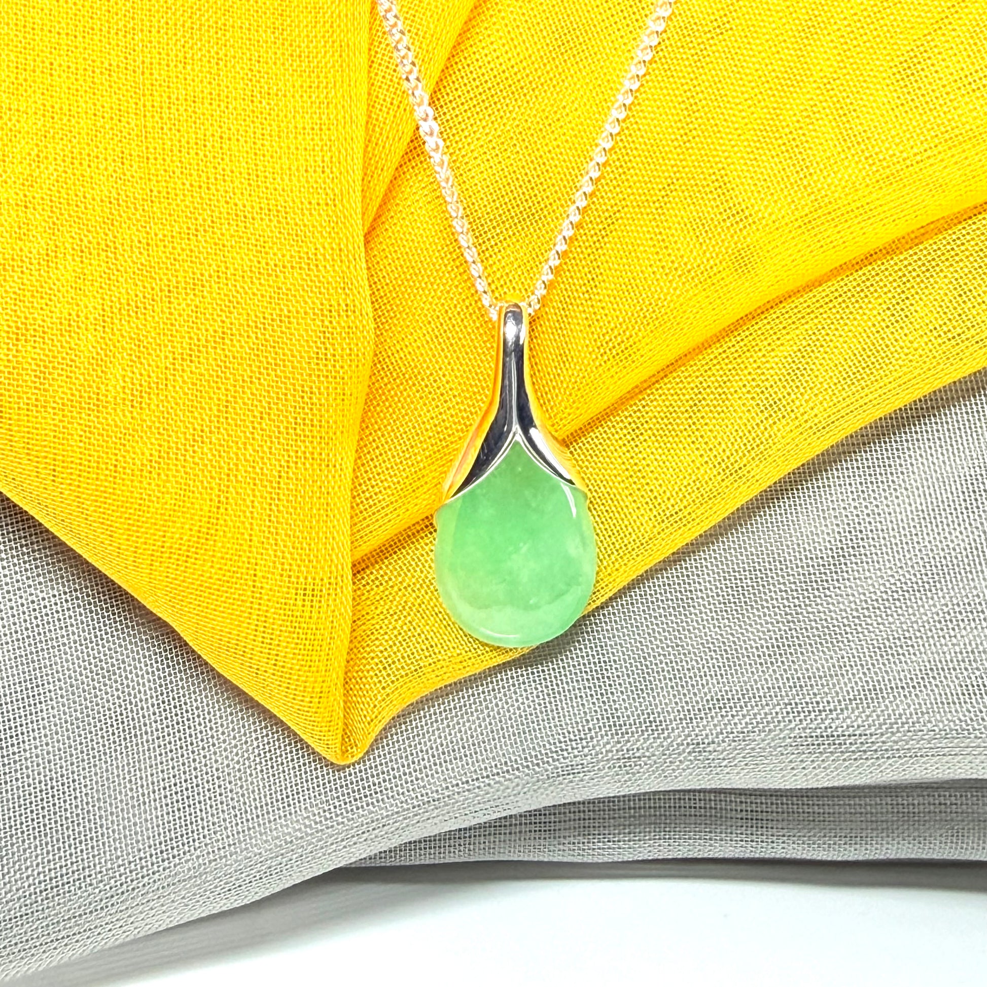 Real green jade necklace in a teardrop shaped or pear shaped, beautiful pendant